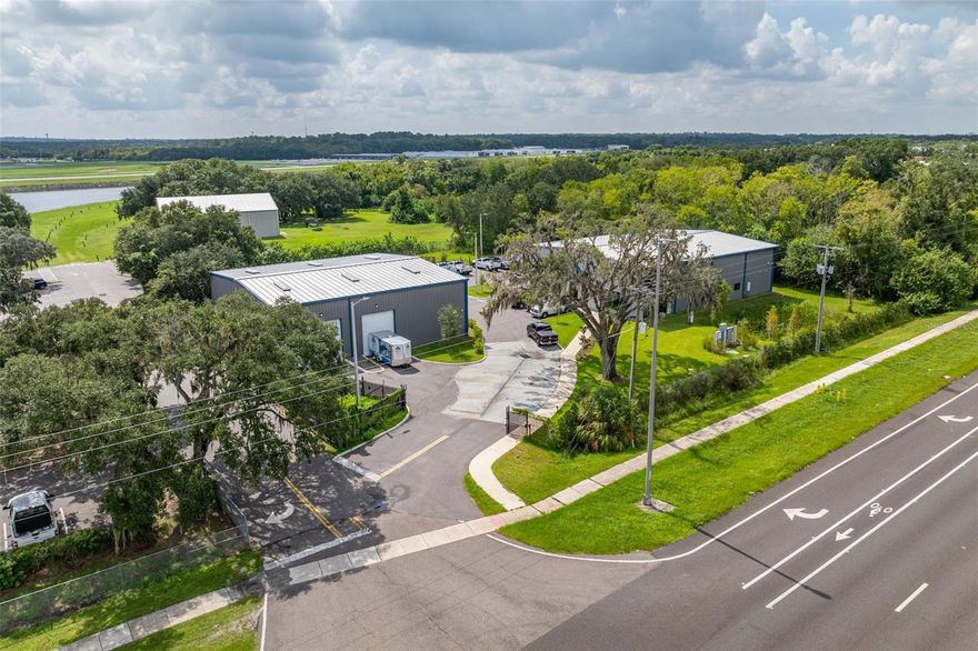 Discover an exceptional opportunity with this nearly brand-new commercial property, strategically located on 4.31 acres with immediate access to major highways including US 301, I-4, and I-75. Built in 2022, this property is a perfect fit for businesses seeking visibility, convenience, and functionality.

Prime Location: Situated just minutes from major highways, this property offers easy access to the entire Tampa Bay area and beyond. The visibility and accessibility make it an ideal location for a variety of business operations.

Modern Office Building: The 6,300 square foot office building is meticulously designed to meet the needs of modern businesses. It features 13 private offices, multiple cubicle areas, a fully equipped break room with a kitchen, 4 private restrooms, a welcoming reception area, and two spacious conference rooms. The structure is thoughtfully designed to allow the addition of a second level, providing further expansion opportunities within the existing footprint.

State-of-the-Art Warehouse: The 4,900 square foot warehouse boasts 20-foot ceilings and is equipped with three electric 17-foot overhead grade-level doors, facilitating seamless loading and unloading processes. Built for durability, the warehouse includes an upgraded concrete slab capable of supporting heavy delivery vehicles and is fully insulated with 4-inch insulation to ensure optimal temperature control.

Infrastructure: The property is equipped with 3-phase power and a 400 AMP service, ready to support a wide range of industrial and commercial activities. The warehouse's advanced lighting and electrical systems ensure efficient and reliable operations.

Ample Parking: The expansive lot includes ample parking for employees, visitors, and large vehicles, enhancing the functionality and accessibility of the property.

Zoning and Compliance: The property is fully compliant with the latest Florida Building Code (7th Edition, 2020), ensuring it meets all current safety and regulatory standards. The property is zoned for various commercial and industrial uses, making it versatile for different business types.

Investment Potential: With its strategic location, modern facilities, and expansion capabilities, this property represents a prime investment opportunity for businesses looking to establish or expand their presence in the Tampa Bay area. The potential for future growth within the property adds significant value to this offering.

Don’t miss out on this unique opportunity. Contact us today to schedule a tour and explore the potential of this exceptional commercial property.