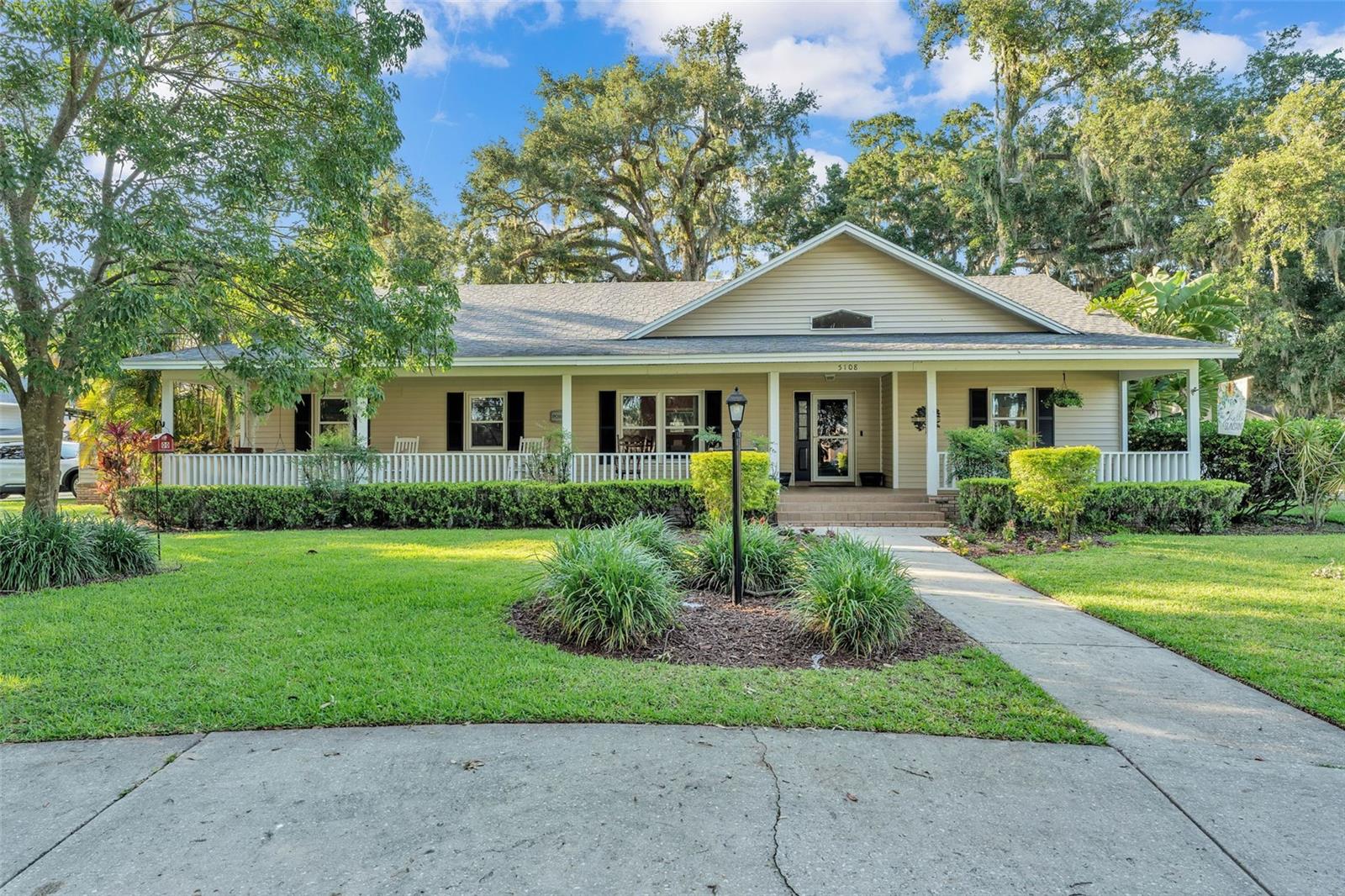 Welcome to 5108 Waterwood Drive – this 3-bedroom, 2-bath home is situated on 0.72-acre lot in a peaceful Bartow neighborhood with no HOA! Enjoy morning coffee or evening breezes from the long front porch complete with a swing – perfect for relaxing. Inside, you'll find a split floor plan, vaulted ceilings, and an open-concept living area designed for comfortable living and entertaining. The kitchen offers ample cabinet space and a convenient breakfast bar. The spacious backyard, circular driveway with plenty of parking, and private irrigation well add both function and value. Ideally located near schools, shopping, the Polk Parkway, Fort Frazier Trail and a nearby public boat ramp.
Bonus space alert! The home includes a 2-car garage, with one side currently enclosed and under A/C, being used as a flexible 4th bedroom. While this space is not included in the heated square footage, it offers great versatility and can be converted back to a full 2-car garage if desired.