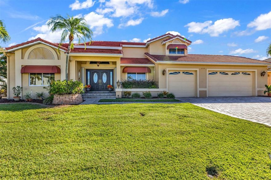 Experience luxury living in this SPACIOUS TURN-KEY 3 bedroom, 3.5 bathroom, 3-car garage pool home with a Family room and Loft, in the highly desirable community of Burnt Store Isles. CLICK ON THE VIRTUAL TOUR LINK 1 FOR THE VIDEO AND VIRTUAL LINK 2 FOR THE 3D TOUR. Offering over 3,500 sq. ft. of living space, this two-story residence is designed for comfort, entertaining, and refined living. From the moment you step inside, you’ll be captivated by the soaring vaulted ceilings, crown molding, Bahama shutters, recessed lighting, and timeless architectural details that set this home apart. The elegant living and dining rooms provide a grand setting for entertaining, flowing seamlessly into the eat-in kitchen. This culinary masterpiece is outfitted with sleek black appliances including a cooktop, granite countertops and backsplash, movable center island, ample cabinet space, walk-in pantry, built-in desk, and a casual dinette with a wet bar with a wine refrigerator. Off the kitchen, the family room with a wood-burning fireplace expands the living and entertaining space, perfect for gatherings with family and friends. On the first floor, you’ll find a spacious guest bedroom with a built-in closet and a nearby bathroom featuring a walk-in shower. Upstairs, the luxurious master suite is a true retreat with a private wood-burning fireplace, large walk-in closet, and an exclusive screened balcony overlooking the golf course and lake. The spa-like master bathroom offers dual vanities plus a makeup vanity, a walk-in shower, and a jacuzzi soaking tub. Just outside the suite, enjoy a private coffee bar with mini refrigerator for added convenience. The upper level also features a second guest suite with a walk-in closet with additional storage, a guest bathroom with a walk-in shower, an office nook, and a versatile loft with built-in shelving that overlooks the living room—ideal for a library, media space, or creative retreat. Outdoor living is equally impressive with an expansive screened lanai, perfect for entertaining while enjoying serene lake and golf course views. The private pool with a waterfall fountain is complemented by a half bathroom and outdoor shower for added convenience. This home was thoughtfully designed with ample storage throughout, from generous closets to built-in features, making it as practical as it is luxurious. 2023 FLAT TILE ROOF - HURRICANE IMPACT WINDOWS & DOORS - WATER SOFTENER. Burnt Store Isles is an optional HOA, deed-restricted, waterfront, and golfing community with Twin Isles Country Club situated in the center of the community. You can also enjoy all the amenities that Punta Gorda has to offer such as biking, fishing, boating, dining, live entertainment, and much more! Schedule your private tour TODAY!