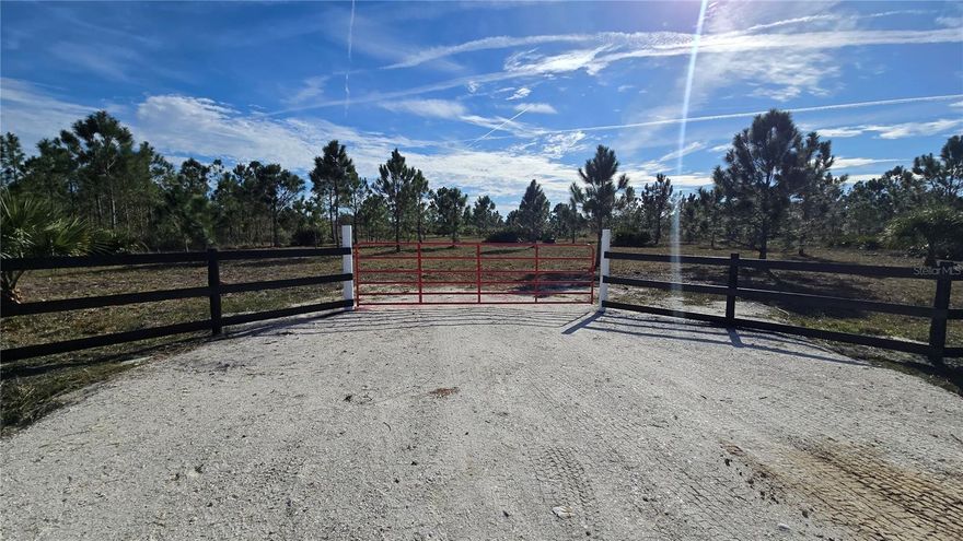 OWNER FINANCING AVAILABLE.This premium 1.25-acre property is fully cleared and ready for immediate use. The landscape features large mature Pine Tree and tropical palms, providing natural shade and privacy. Professional infrastructure is complete, including an installed heavy-duty culvert and a stabilized gravel entrance. The front perimeter is lined with high-quality board fencing and a red steel farm gate. This turn-key lot is a level and blank canvas for a custom home or agricultural project in a quiet area with no HOA. The road already has electric lines run to the end for easy hookup.