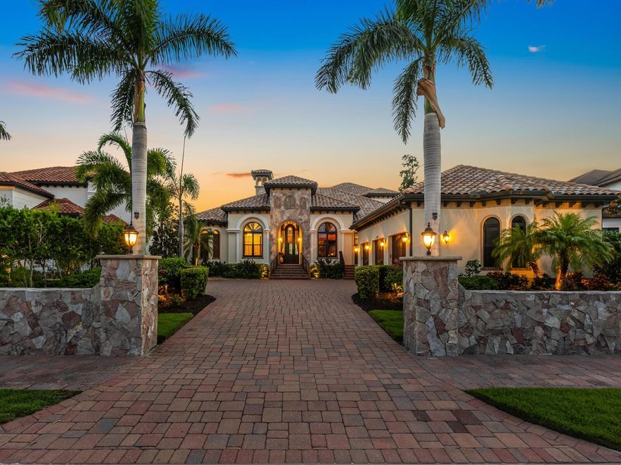 Welcome to the market for the first time, this elegant custom built estate located in the exclusive private gated community of  Blackburn Ridge, situated on Blackburn Bay and the Intracoastal Waterway which is near the communities of Osprey, Laurel, Nokomis, and Casey Key. 
Welcoming you at the entry to this estate, you will find a 68’ stone wall, which each piece was hand cut to give a dry fit appearance.  Enter through the hand crafted custom entryway door and immediately take in the view from the beautiful water beyond.  This estate boasts 4 full bedrooms and 5 full baths, with the entire second story designed for entertainment with its theater room seating and built in bar, complete with dishwasher, ice maker and wine cooler.  There is also a full bath and murphy bed, which this space could easily serve as a second master suite is so desired. From the second floor, you can enjoy the natural beauty of the water views from the full-length balcony.  The chef’s kitchen will delight all cooking professionals and enthusiasts with its expansive island and Thermador appliances.  The custom wine cellar with its vineyard murals will make you think you are in Tuscany! Host your guests in the stunning dining room as you enjoy watching the sunset.  The living room creates a fabulous gathering space with its custom fireplace and volume ceilings.  The immense master suite provides waterfront views, separate sitting area, and his and hers custom walk-in closets.  The master bath includes soaking tub, oversized shower, and private commode. Jack and Jill bedrooms are ensuite, as well as the remaining bedroom.  Make endless memories with family and friends while entertaining on the patio, with full kitchen and saltwater pool.  The 90’ no profile dock with hydraulic remote-control lift allows you access to the intracoastal waterway via kayak or paddle board.  If you are a boater, there is a full-service Marina just minutes away. To complete this estate is an oversized 3 car garage, with elevated ceilings for all your storage needs, whole house generator, impact windows and doors, 2 a/c’s with dehumidifiers, water and electric at dock, solar outdoor lighting, fenced in dog run, and mini split in wine cellar.  Just a short drive to the top Gulf beaches, shopping, and restaurants, this is the perfect place to live the luxurious waterfront lifestyle that the West Coast of Florida has to offer.