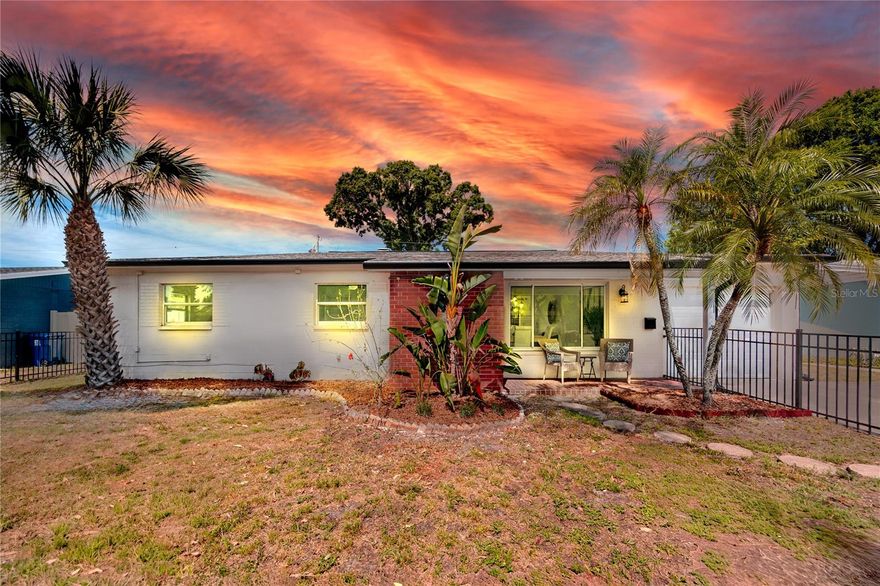 Welcome to this light filled, move-in-ready 3 bed, 2 bath concrete block retreat in desirable Meadow Lawn — ideally located just 10 minutes from downtown St. Petersburg, I-275, and 25 minutes from St Pete Beach and other Gulf beaches.

From the moment you step inside, you’re greeted by an open, flowing layout connecting the living, dining, and kitchen areas — designed for both everyday comfort and effortless entertaining. The updated kitchen features granite countertops, stainless steel appliances including a gas range, with ample cabinetry all overlooking the main living space. The attached garage offers convenient access directly into the kitchen, making everyday tasks like unloading groceries simple and efficient.

The spacious living room features a gas fireplace, ideal for relaxing or entertaining. Just beyond, a versatile bonus room that offers flexible use as a home office, playroom, or additional living space, while the screened porch creates a seamless transition to outdoor living.

The fully fenced front and backyard provide excellent space for pets, play, gardening, and future enhancements (including room for a pool), making this home especially appealing for those who value outdoor living and privacy.

Notable features include natural gas service for the stove, water heater, dryer, and fireplace — offering efficiency, reliability, and added convenience. The home is also located on a priority power grid, which along with the natural gas adds an extra level of confidence during storm season.

Situated in a quiet, established neighborhood, this home is within walking distance to multiple parks, including nearby Sawgrass Lake Park. It is just two blocks from St. Petersburg Christian School and conveniently located near local public schools.

No flood zone. No flood insurance required.

Schedule your private showing today and experience the best of St. Petersburg living.