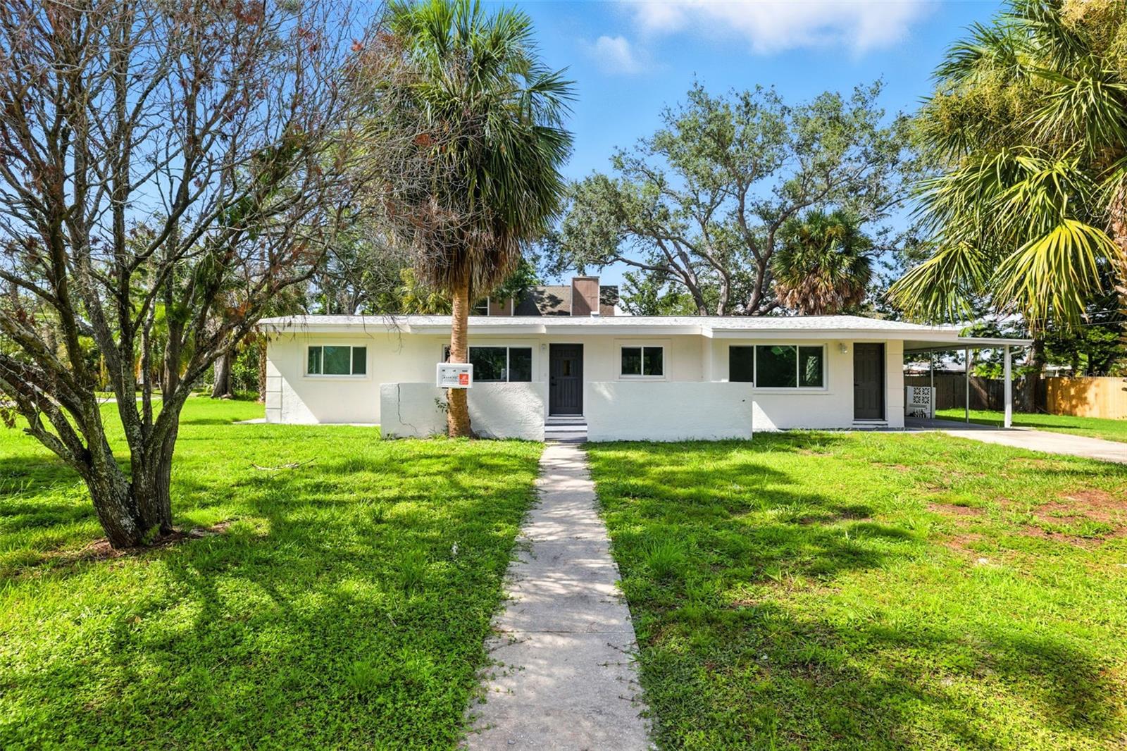 Welcome to 695 Sunset Lane, a fully remodeled coastal retreat tucked away in the heart of Tarpon Springs. This beautifully updated 3-bedroom, 1-bath home sits on a spacious corner lot with a long driveway and 1-car carport, offering convenience and plenty of parking for family and guests. Just minutes from the sparkling Gulf waters and the world-famous Tarpon Springs Sponge Docks, this property is perfect for anyone looking to embrace the Florida lifestyle. The neighborhood is boat-friendly, making it easy to enjoy fishing, boating, and all that the local waterways have to offer.
Inside, you’ll fall in love with the thoughtful upgrades and inviting atmosphere. The home has been freshly painted in neutral colors and features tall ceilings, new luxury vinyl flooring throughout, and an open layout that feels bright and welcoming. The living room is highlighted by a custom accent wall and large sliding glass doors that open to a massive covered lanai, extending your living space outdoors for year-round entertaining.
The gorgeous kitchen is truly the heart of the home, showcasing brand-new cabinetry, granite countertops, a breakfast bar, and stainless steel appliances. Whether you’re preparing a family meal or entertaining friends, this space is both stylish and functional.
The primary bedroom is oversized and split from the secondary bedrooms, offering a private retreat. The fully remodeled bathroom features a new vanity and a charming bathtub with herringbone-patterned tile, adding a touch of elegance and character.
Every detail has been carefully considered to make this home truly move-in ready. With its prime location near shopping, dining, top-rated schools, and just steps from the ocean, 695 Sunset Lane is an incredible opportunity to own a slice of paradise in Tarpon Springs. Perfect as a primary home, vacation getaway, or investment property!
Beyond the home itself, Tarpon Springs offers a lifestyle unlike any other. Known for its rich Greek heritage and historic Sponge Docks, the area is filled with unique shops, authentic Greek restaurants, bakeries, cultural festivals, and waterfront attractions. From exploring the charming downtown district to enjoying boat tours, kayaking, or strolling along the Anclote River, there’s always something to do. Living here means more than just owning a home—it’s about being part of a vibrant community with history, culture, and endless opportunities for fun on the water.