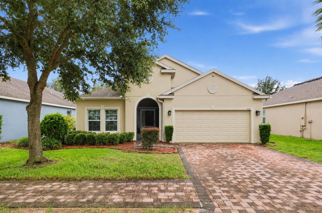 Photo of 225 Lakeshore Drive, Davenport, FL 33837 (MLS # TB8552067)