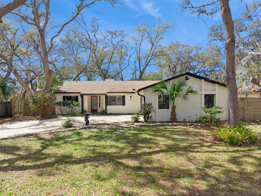 Dommerich Woods gem! Tucked away on a cul-de-sac street in one of Maitland’s most sought-after neighborhoods, this beautifully updated 3-bedroom, 2-bath block home is the one you’ve been waiting for. Move-in ready and genuinely charming from the moment you walk in.

The open floor plan feels airy and welcoming, with vaulted ceilings and natural light pouring through every room. The living room centers around a classic brick fireplace that anchors the space perfectly, while the kitchen is a true standout-quartz countertops, stainless appliances, 40-inch soft-close shaker cabinets and a built-in pantry. The layout flows effortlessly between living, dining and family spaces, making it as functional as it is inviting.

The split bedroom layout offers great privacy for everyone. The primary suite is a real retreat- vaulted ceiling, spacious walk-in closet and a completely redone en-suite bath with a lovely garden window. Both bathrooms have been given a fresh, modern look that feels clean and polished.

The updates list is long and impressive: newer LVP flooring throughout,  AC (2022), water heater (2023), roof replaced in 2016, replumbed in 2008, newer paint inside and out, newer light fixtures and ceiling fans. Laundry is indoors and connects right to the two-car garage-a detail you’ll appreciate daily.

Out back, the yard is a genuine sanctuary. Mature trees, lush landscaping and total privacy make it the kind of space you’ll actually use. A large shed with 50-amp power is ready for a workshop, hobby space or serious storage-and with no HOA, bring the toys too!
Just minutes from Kewannee Park, the Seminole bike trail and easy access to major roads and local shops and restaurants. It’s a rare find in a neighborhood where homeowners rarely leave. Come take a look.