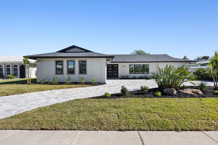 Waterfront Luxury Without Compromise in a home that was never flooded by the Hurricanes. 
Positioned on deep water in the heart of Island Estates, this fully reimagined 4-bedroom, 3 full , 2 half-bathroom residence delivers the kind of waterfront life most people only dream about and it does it without a single item left on your to-do list.
Set on sailboat water with direct, bridge-free access to the open Gulf, larger vessels dock with ease at the private 30x6 ft dock, and open water is minutes away. This is not a boating community nod, this is a true boater's address.
Inside, a top-to-bottom Scandinavian-inspired renovation creates a home that feels as calm and intentional as its setting. Wide plank engineered hardwood floors anchor the open concept layout, where every room flows with purpose. The chef's kitchen features a large island, quartz countertops, a walk-in pantry, and a dedicated breakfast counter that makes the kitchen feel like a destination of its own. Two primary suites  each with private en-suite baths and walk-in closets offer flexibility for multi-generational living, frequent guests, or simply having your own world within the home.
Step outside and the pool, deck, and canal align in one uninterrupted sightline. The outdoor half bath keeps the entertaining seamless, and the west-facing exposure means evenings here are something special.
Every major system has been replaced:

New roof
New HVAC and ductwork
Hurricane impact windows and doors throughout
New bathrooms and water heater
Paver driveway

Per the seller, this home has remained high and dry through every recent storm — a rare and meaningful distinction at this price point.
A quick golf cart ride puts you at Publix, local restaurants, and everyday conveniences, with Clearwater Beach just minutes beyond. Island Estates is one of the most sought-after waterfront communities on Florida's Gulf Coast, and this address sits right at the center of it.
Move-in ready. Zero deferred maintenance. Nothing left to do but live here.
Schedule your private showing today.