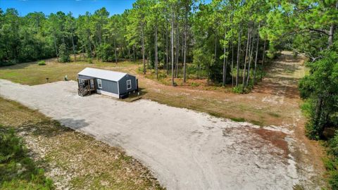 Photo of 7576 N Heller Avenue, Dunnellon, FL 34433 (MLS # TB8428978)