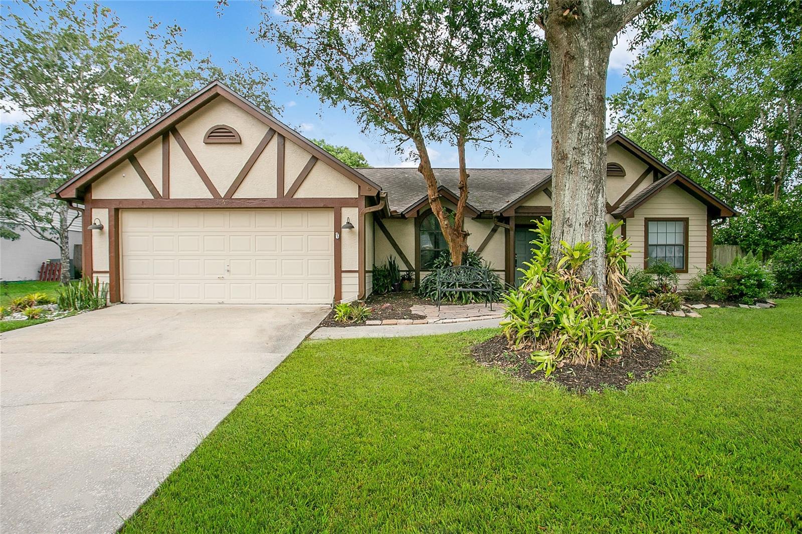 Tucked at the end of a quiet cul-de-sac on over a quarter acre, this home feels like the kind of place you settle into — and stay. The curb appeal is classic and welcoming, with Tudor-style details, mature trees, and a front patio made for morning coffee. Inside, the floor plan works the way real life does. A dining room greets you off the foyer, setting the stage for gatherings. The kitchen sits at the center of the home — the spot where meals come together and conversation lingers — with stainless steel appliances, warm cabinetry, and a clear view into the family room so no one’s ever left out. The primary suite is privately set apart, with a private access to the pool, a walk-in closet and an ensuite offering dual sinks, a soaking tub, and a separate shower. Two additional bedrooms and a full bath sit on the opposite side, giving everyone their own space. Step out back and you’ll see why this home is just as much about the outdoors. A screened-in pool, covered patio, and fenced backyard create a private retreat you can enjoy year-round. There’s space for grilling, space for play, and space to simply unwind under the shade of mature trees. Notable updates include: a new stainless steel stove, vent hood, and dishwasher (2022), Tesla charger, new roof (2018), pool pump (2021), A/C (2017), and AC ductwork (2023). This home keeps you close to everything — top rated schools, Saturday mornings at the farmers market, afternoons on the trails at nearby parks, dinner at local favorites, and quick access to UCF, Winter Park, or downtown Orlando. This isn’t just a property — it’s the setting for the next chapter. A home made for gatherings, quiet escapes, and a location that keeps everything you love within reach.