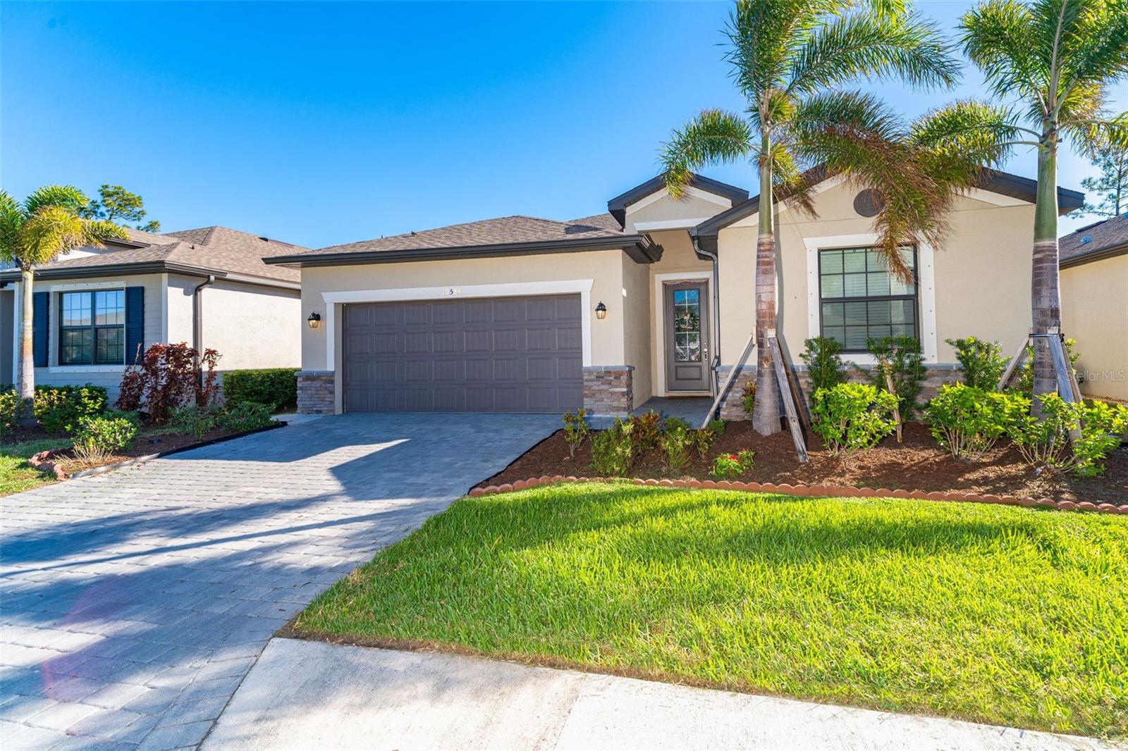 A 2022 LENNAR BUILT home in the sought after and deed restricted community of "TORTUGA", one of WELLEN PARK'S intimate GATED communities! This beautifully Lennar built, SMART home is just waiting for you to call it your next treasured home! This PERFECTLY DESIGNED 2,032 sq. ft., home, features 4 SPACIOUS BEDROOMS and 3 FULL BATHROOMS! The OWNER'S SUITE HAS 2 WALK-IN CLOSETS, stunning large ENSUITE BATHROOM WITH HUGE GLASS ENCLOSED WALK-IN SHOWER, SEPARATE WATER CLOSET, AND LARGE VANITY WITH DUAL SINKS. The chef in your family will just love the KITCHEN, COMPLETE WITH STAINLESS STEEL APPLIANCES, GRANITE COUNTERTOPS, an abundance of WOOD CABINETS, a LARGE PANTRY, and BREAKFAST BAR, which overlooks the spacious family room and dining area.. The OVERSIZED FAMILY ROOM has endless possibilities for decorating, and its open floor plan includes the dining and eat-in area. BEDROOM 2 ALSO HAS AN ENSUITE BATHROOM WITH A TUB & SHOWER. This SMART home has a RING Video doorbell system, brick paver driveway, entryway and lanai. The community of Tortuga has an area park and playground for its residents to use, which is just a short distance from this home. The HOA Fee includes a maintenance free, gated community, lawn mowing, edging, fertilization, water for irrigation, cable TV and internet! The community of Tortuga, made up of single-family residences, is WITHIN MINUTES OF THE NEW WELLEN PARK and all the fabulous amenities it has to offer, AS WELL AS THE NEW COSTCO! All that Venice has to offer and all that you could possibly want in the form of shopping, entertainment, dining, beaches, fishing, golf, the interstate, CoolToday Park: which is the spring training home of the Atlanta Braves of Major League Baseball, and more, is just a short driving distance away! How could you want to live anywhere else? Schedule your showing today and make this your next "HOME SWEET HOME!