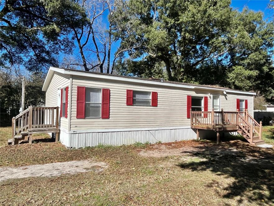 Charming 3-Bedroom, 2-Bath split floorplan 1,296 square feet home. Welcome to this well-maintained 2001-built home with upgrades including a new roof (2019) and an updated central HVAC system (2017). Located in a highly desirable central area on a paved road, you'll enjoy quick access to HWY 484 and I-75, placing you conveniently between Ocala and The Villages for shopping, dining, and entertainment. As an added bonus, the seller has installed brand-new carpet in all three bedrooms and freshly painted the interior. See this home today!