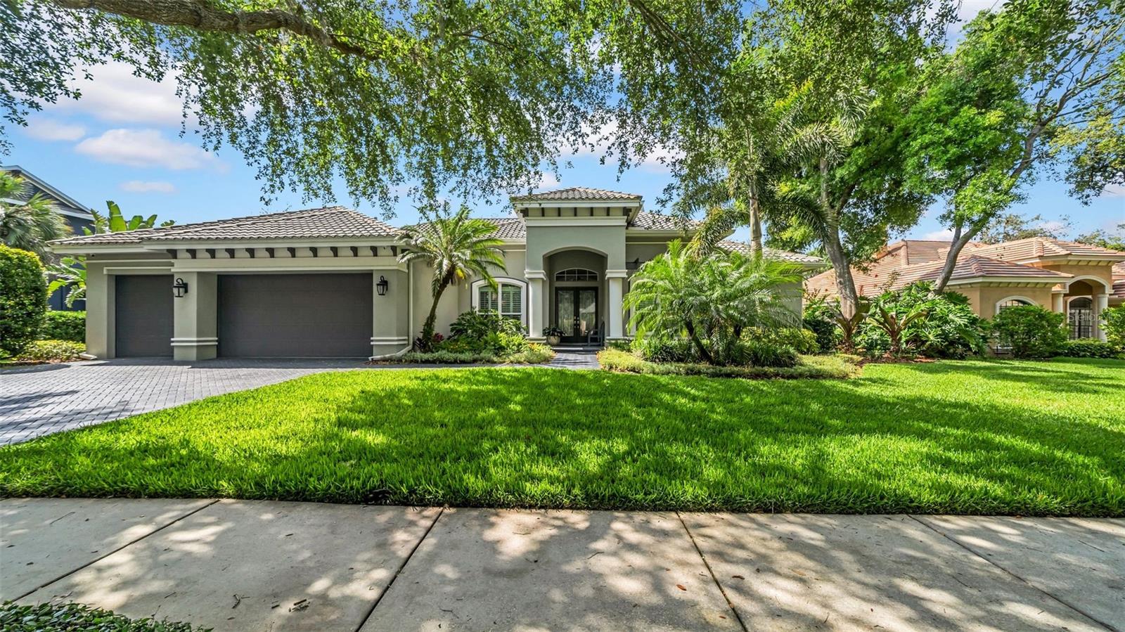 Exquisite executive home perfectly situated on a .38-acre conservation lot within the highly sought-after gated neighborhood of Avocet in Fishhawk Ranch. Offering 5 bedrooms, 4 bathrooms, a 3-car garage, and over 4,100 square feet of beautifully designed living space, this pool home also includes two bonus rooms — one of which can serve as a 6th bedroom — providing ultimate flexibility for your lifestyle needs. The professionally manicured front gardens and decorative glass entryway create a warm and elegant first impression. Upon entering, you are immediately drawn to the breathtaking views of the sparkling pool and spa, framed by a formal living room featuring a cozy fireplace and an expansive 3-panel sliding glass door that floods the space with natural light. Just off the living area, the private office and the luxurious primary suite are ideally located. The spacious primary bedroom features private access to the lanai, while the spa-like en-suite bathroom is appointed with dual vanities, a jetted tub, and a separate walk-in shower — an ideal retreat after a long day. At the heart of the home, a chef’s dream kitchen awaits. Stunning quartzite countertops and backsplash provide a seamless, refined look. High-end appliances include a Wolf gas stove with electric oven and griddle, a second Wolf oven and microwave, a Bosch dishwasher, and an impressive built-in Sub-Zero refrigerator and freezer, framed beautifully by an arched entry leading to the pantry and laundry room. The oversized island, comfortably seating six, makes this space perfect for both entertaining and everyday living. The adjoining family room, enhanced with a unique ceiling fan and 3-panel pocket sliders, seamlessly blends indoor and outdoor living. Bedrooms 2 and 3 share a well-appointed full bathroom, while Bedroom 4 enjoys a private hallway, adjacent to its own full bath with direct access to the lanai — ideal for guests or extended family. A spacious bonus room with vaulted ceilings and lanai access offers endless possibilities, from a playroom to a home gym or studio. Bedroom 5, located beyond the bonus room, includes a walk-in closet and private bath, making it perfect for an in-law suite. Upstairs, a charming bonus room — ideal as a media room, playroom, or sixth bedroom — features wood stairs, cozy carpet for sound absorption, and abundant space for relaxation or entertainment. Throughout the first floor, brand new luxury vinyl plank flooring offers both beauty and durability, complemented by elegant plantation shutters on every window. Step outside to experience true Florida living. The expansive lanai offers three covered areas plus ample space for sunbathing and entertaining. The backyard, surrounded by a harmonious blend of natural and manicured landscaping, provides exceptional privacy. A stone firepit adds to the inviting atmosphere, perfect for cozy evenings under the stars. Enjoy the added comfort and security of triple-pane, hurricane-rated windows and sliding doors — blending quiet elegance with storm-ready durability. Zoned for top-rated A+ schools and conveniently located near shopping, dining, and I-75, Fishhawk Ranch also offers unparalleled amenities including miles of nature trails, multiple pools, fitness centers, recreation facilities, dog parks, and more. Don't miss the opportunity to make this extraordinary home your own — schedule your private tour today!
