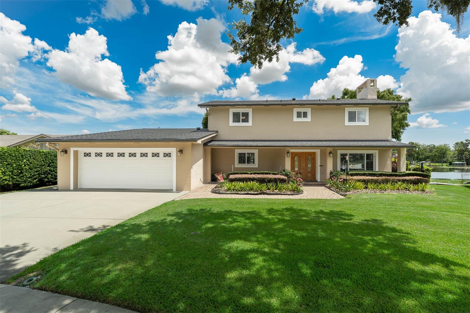 Stunning Lakefront Retreat in Winter Park! Welcome to your dream home on beautiful Lake Waunatta! This spacious and upgraded 5-bedroom/1-office/3-bathroom lakefront property offers over 3,850 sq. ft. of living space (5,113 sq. ft. total) on a nearly half-acre lot with ~100 feet of private shoreline. Enjoy breathtaking lake views from multiple rooms and the balcony. Open floorplan offers flexible living arrangements. Enjoy morning coffee/tea from the Florida Room to take in the glorious sunrise over the lake! Perfect for entertaining or relaxing, this home features a large, updated kitchen with an eat-in area, formal dining room, expansive living/family room, and a bright Florida Room with a stunning view. The large master suite is a luxurious retreat with a marble shower and a jacuzzi tub. Step outside to a huge dock with a covered boat house with powered lift, two jet ski lifts, and plenty of space to watch beautiful sunrises, rocket launches, and fireworks. The backyard is shady, spacious, and serene — perfect for morning sunrises or afternoon relaxation. Lake Waunatta is a ~72-acre private, spring-fed lake with no public access. It’s ideal for powerboating, jet skiing, windsailing, paddleboarding, and fishing. The property sits on an elevated lot that provides stunning lake views and minimizes flooding concerns. The home was extensively renovated and expanded in 2003, including updated plumbing, electrical, and structural additions. Recent upgrades include a new roof, new windows, sunshades, and new AC unit. Located on a quiet, limited-access street, you’re just minutes to Publix, Target, parks, restaurants, and top-rated schools. Easy access to Full Sail, UCF, Downtown Orlando, and airports. Don’t miss this rare opportunity to own a private slice of lakefront paradise, and to enjoy the best Florida offers, right from your backyard! This home offers the best value on a natural private ski lake in Winter Park!