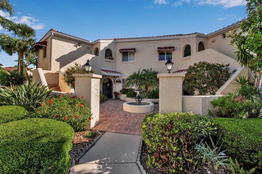 VIZCAYA!  You know even the name takes your imagination away!  This exceptional 3/2 Lakefront beauty is truly a cut above the norm...includes brand New $11,000 A/C installed 5/27/25 and even showcases designer furnishings which will be included with acceptable offer!  This gem has not only one large lake vista but also nestled with views of a second!  Charming, "Old World" Mediterranean architecture with its entry courtyard and tiered fountain will catch your artistic eye.   A custom wrought iron gate invites you through the alcove into this gorgeous, immaculate piazza!  Beautiful tropical visions from the lake the moment you walk in the door.  Immediately you'll feel the comfortable living you have been seeking due to its' expansive wide floorplan designed more like a single-family home than a typical linear condo.  Choice eastern exposure off the lake plays to the casual elegance of the interiors enhanced by the natural light and the desirable vaulted ceiling along with pristine, luxury carpet.  The Great Room flows out to the big tiled and glassed Florida room - beckoning for relaxation.  The stylish, upgraded kitchen is open and airy...granite counters, ease of sliding pull out drawers and with a breakfast table area looking down through planation shutters to the front courtyard with peaceful fountain sounds.  Private guest quarters and versatile third bedroom/den with closets have their own indoor/outdoor appeal with a terraced balcony.  Attractively updated second bath.  The primary bedroom, graciously sized with a vaulted ceiling and views out to the lake, features large walk-in closet and a delightfully upgraded en-suite bath with double vanities, customized mirrors and lightening, soaking tub and Roman walk-in shower.  In addition to being able to keep your doors open almost year round to catch cool, cross breezes from the second floor, you get the incalculable value of not having the pitter-patter of anyone above you.  (Remember that first floor units do not have the advantage of the high ceilings, breezes and privacy as mentioned - it does matter!.) Vizcaya is known for its outstanding Clubhouse and Olympic sized geothermally heated pool with additional amenities such as exercise room & sauna.  Along with all of the conveniences of nearby shopping, approximately 8 miles to the renowned Gulf beaches and close proximity to downtown Sarasota with its cultural activities.  Includes carport, is pet friendly, and has the added appeal of being a gated community.