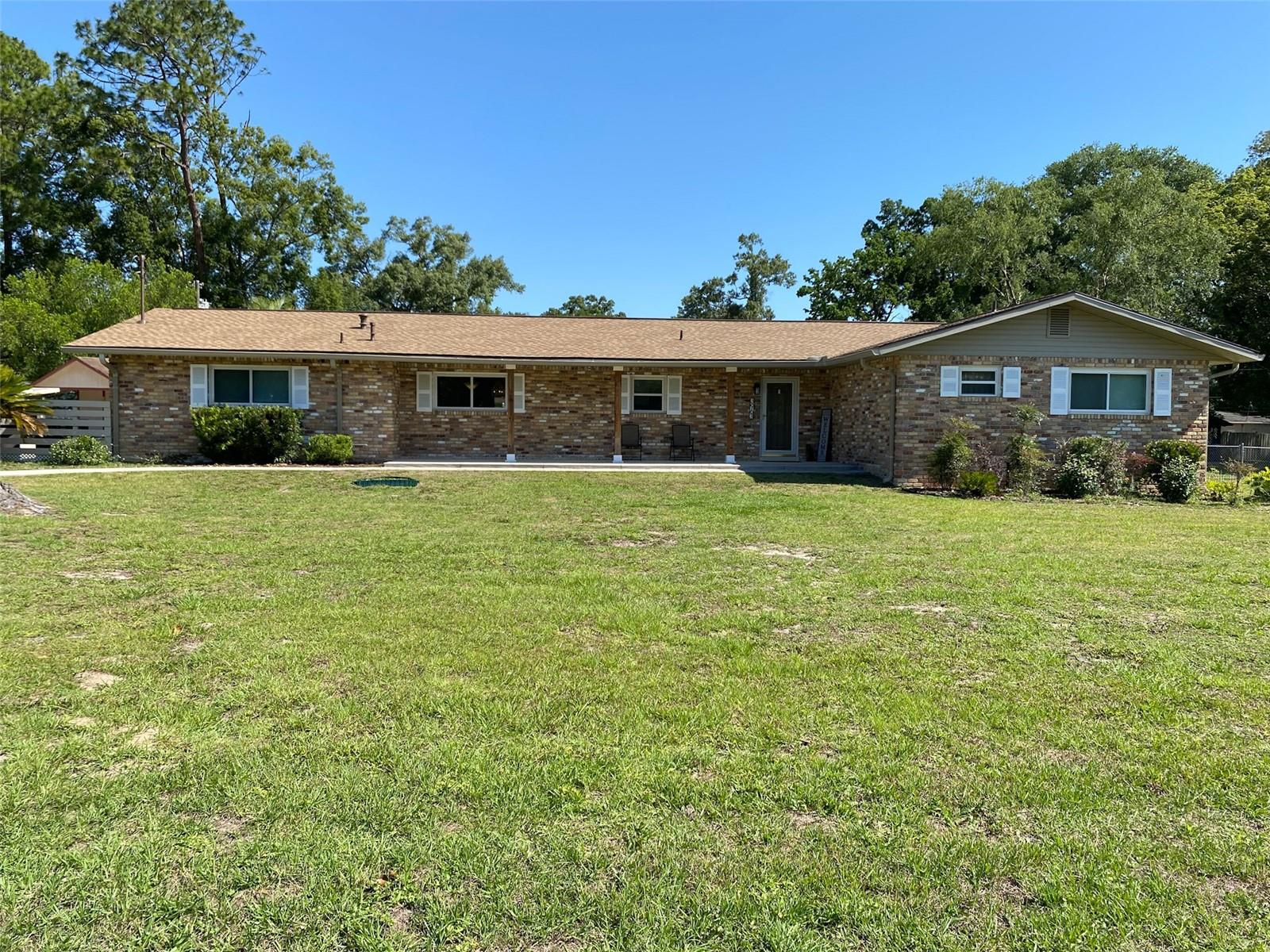 This is your opportunity to own a Beautiful, Well Cared For Home in Highly Sought After SE Ocala. From Curb Appeal to Comfortable Living....you will Thoroughly Enjoy Plenty of Space Inside and Out. Starting with an Over-sized .77 acre lot, the outside of this home gives plenty of room for you and your family featuring a Generous Parking area next to the Side Entry Garage and a Walkway leading to the Over-sized Front Porch. There is also a Very Large Air-Conditioned Rear Porch that overlooks the Expansive Back Yard. Inside you will be impressed as well with a Comfortable Family Room complete with Fireplace with an Above Fireplace TV Included, Updated Kitchen with Custom Cabinetry, and a Very Spacious Dining Room. Also...No Worries with a Brand New Roof, New Garage Door/Opener, Newer HVAC unit and so many other updates! What about the Bonus Shed, or the Indoor Laundry and Storage Room? The list goes on and on...Don't Miss This One!