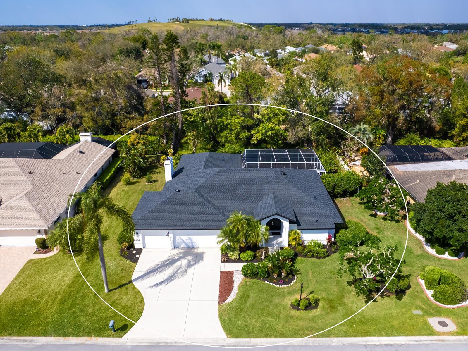 One or more photo(s) has been virtually staged. Sanctuary in Sarasota. Stunning home with many upgraded finishes in Palm Aire of Sarasota constructed by quality custom-home builder Najjar Construction. Welcome to this move-in ready exceptional single-family home in a sought-after neighborhood boasting large lots and convenient location. This beautifully designed residence offers 2,176 square feet of luxurious living space, 3,365 total area square feet featuring three bedrooms, two baths, a three-car garage and an oversized one-third acre lot with mature landscaping. Step inside to find an open floor plan with vaulted ceilings, skylights, custom cabinetry, designer finishes and whole-house air purifier. Recent updates include a new roof December 2024, and a freshly painted interior and exterior February 2025. This home has been impeccably maintained. The gourmet kitchen is a chef's dream, boasting high-end appliances all replaced within the past three years, blue pearl granite countertops and spacious breakfast bar. The primary suite is a private retreat, complete with spa-like bathroom, two walk-in closets and private patio access. The open floor plan features a family room with matching blue pearl granite-surround fireplace and cedar wall, ideal for cozy family gatherings. Outdoor living is just as impressive, featuring a large covered screened lanai, outdoor eating bar and recently renovated private pool with a blue aqua PebbleTec interior. A pass-through from the kitchen with a storage cabinet adds convenience. The beautifully landscaped backyard is private and ideal for entertaining or unwinding. In the exclusive Palm Aire of Sarasota community, residents have low HOA fees, and no CDD fees. Enjoy proximity to airports, top-rated schools, beaches, UTC Mall shopping, dining, downtown Sarasota and a golf course community. Don't miss this opportunity to own a custom-built quality masterpiece by Najjar Construction. Schedule your private showing today!