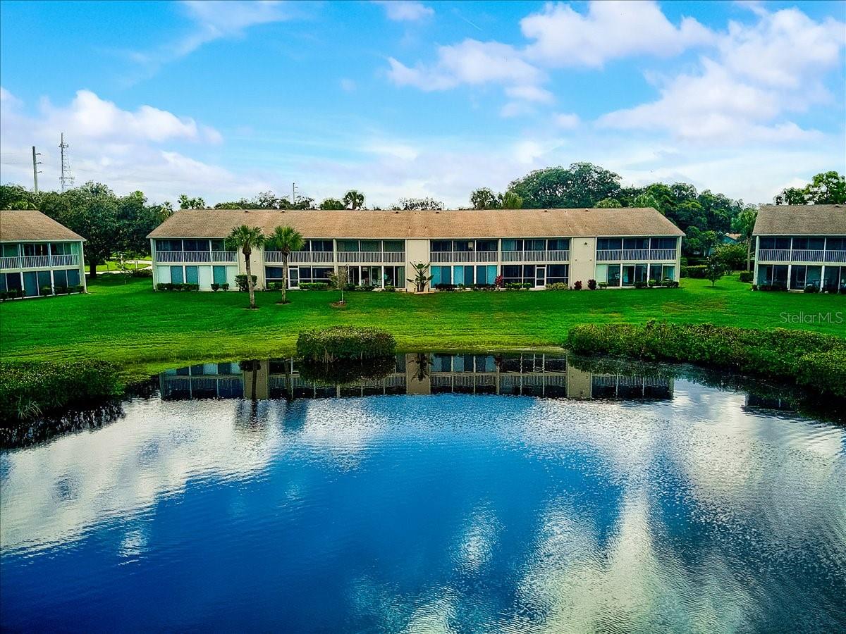 Find your little piece of paradise right here at Waterside’s Bird Bay Village. This 2-bedroom, 2-bath unit has everything you are looking for in a home or winter get away. It is a 2nd floor unit (no elevator) with stunning views of one of the many ponds in the community. The lanai is enclosed and equipped with AC adding extra square footage of livable space all year long. As soon as you enter this cozy condo you will notice it is freshly painted throughout and awaits your personal style. The kitchen is filled with natural light and has ample room for a bistro table and chairs. The primary suite offers dual sinks, walk in closet and direct access to the lanai and its stunning views. This community features 5 swimming pools, tennis, pickleball, fitness center, easy access to the Legacy Trail and so much more. Centrally located near I75 for easy access to Sarasota and Naples airport, incredible beaches, fine dining, and too many golf courses to list. In a little over 2 hours, you will arrive at major attractions like Disney World, Sea World, Busch Gardens and Universal Studios. Shop until you drop at the UTC Mall or in an hour head to the International Mall in Tampa.