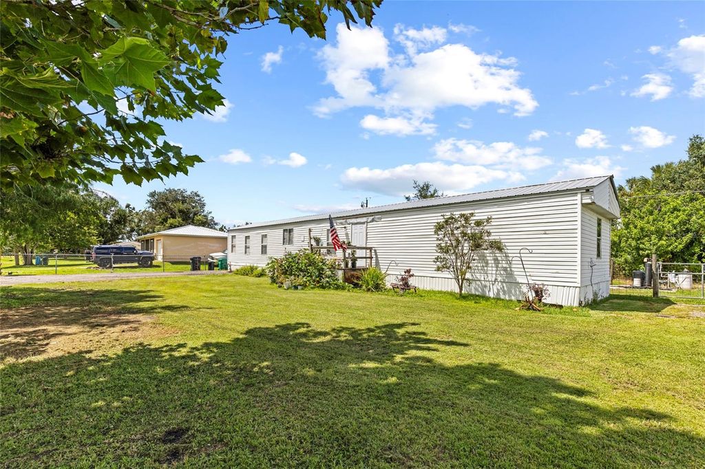 Photo of 6585 NE 7th Street, Okeechobee, FL 34974 (MLS # OK225547)