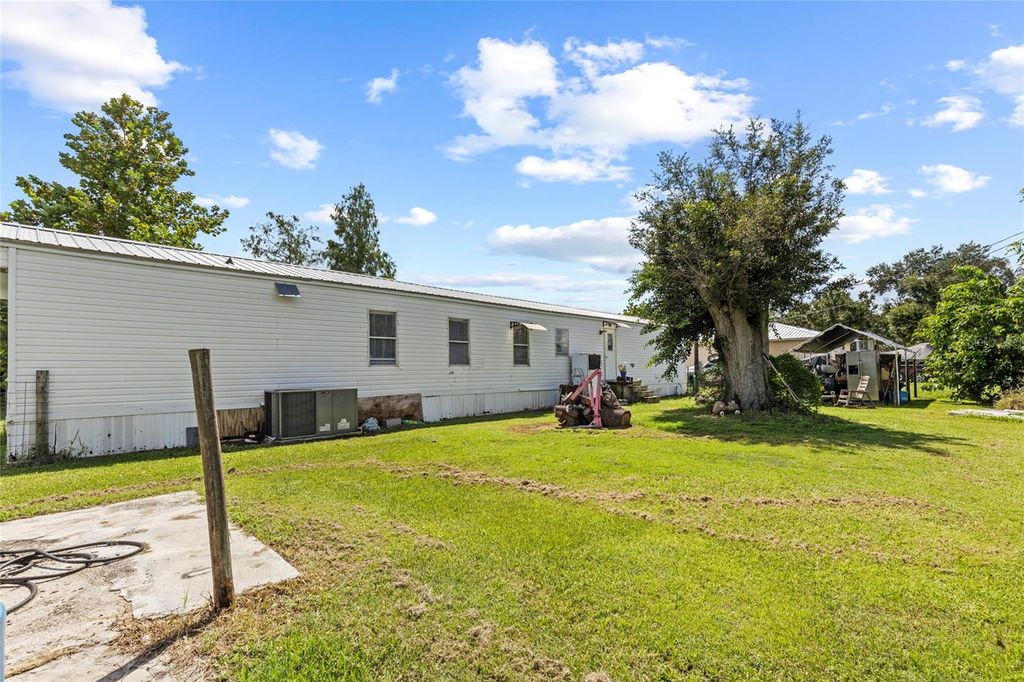 Photo of 6585 NE 7th Street, Okeechobee, FL 34974 (MLS # OK225547)