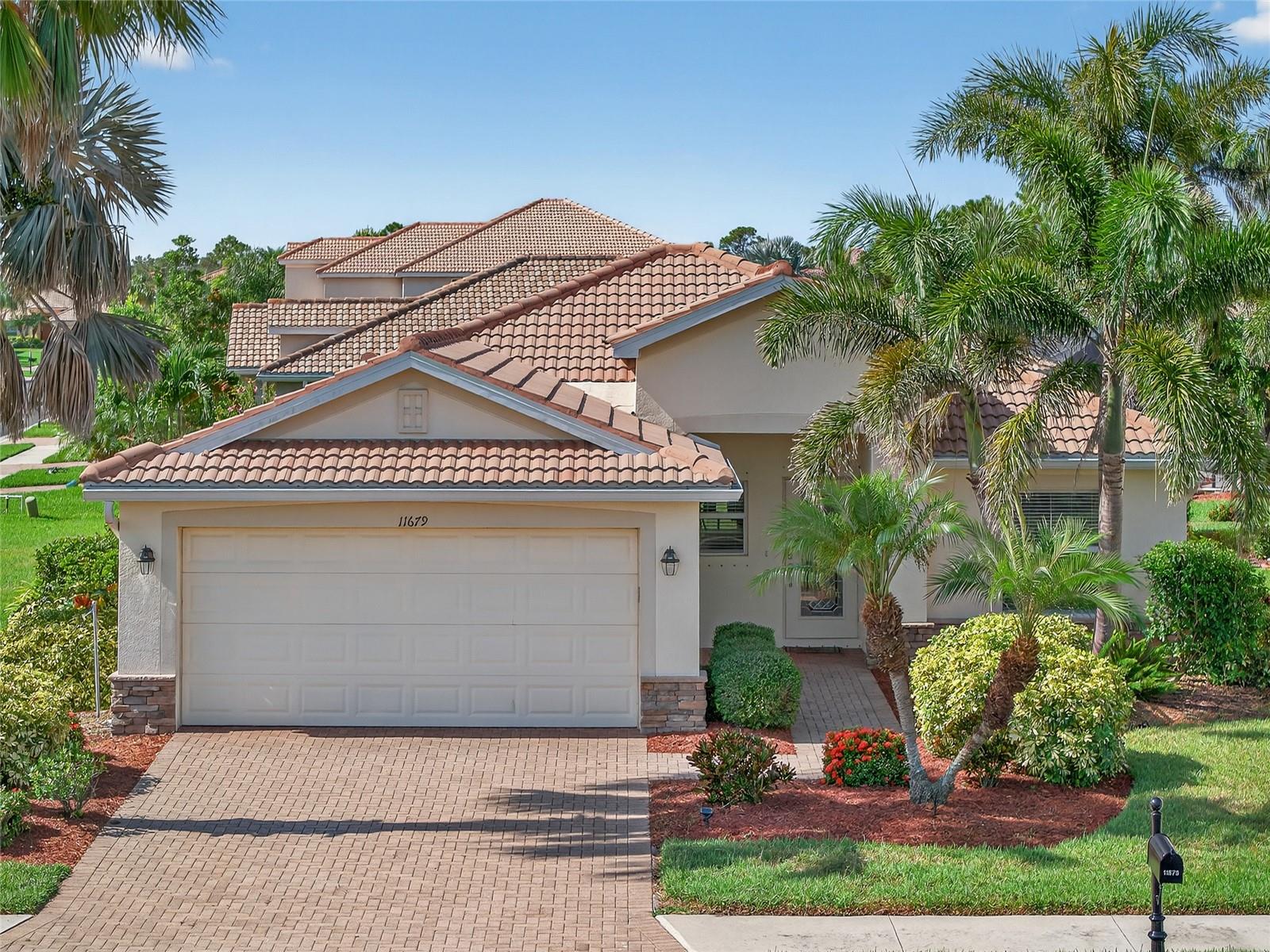 PRICED TO SELL! CORNER LOT 3 BEDROOM, 2 BATH, 2 CAR GARAGE, POOL HOME LOCATED IN GATED STONEYBROOK IN VENICE! Stunning curb appeal with mature and lush exterior landscaping. Step inside where you will find a freshly painted open floor plan with high ceilings, crown molding, and tile flooring in main living and dining areas. The kitchen offers maple wood cabinetry, granite countertops, stainless steel appliances, closet pantry and breakfast bar great for entertaining. Generous primary suite features large walk-in closet and private en-suite bath offering dual sinks with marble countertops and walk-in shower. Split floor plan provides guests with plenty of privacy with 2 additional bedrooms and a full guest bath. Outdoors provides a partial view of the lake with screened lanai and heated saltwater pool. Additional features include water softener, inside laundry room with cabinetry, sealed paver driveway and lanai, variable speed pool pump, and removable hurricane shutters. Stoneybrook amenities include gated access, park/playground, community swimming pool and lap pool, water aerobics, fitness center, library, bocce ball, tennis, pickleball and many events. Located near restaurants, shopping, schools, parks, golf, and entertainment plus much more. Enjoy biking, fishing, boating and strolling on the nearby beaches! Don't miss out on this opportunity to make this beautiful home your new Florida retreat. Schedule your private showing today!