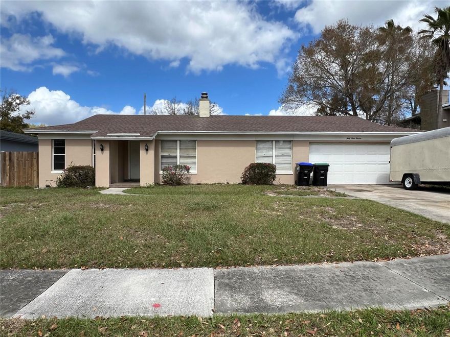 Move-In ready! Ideal location between Maitland, Winter Park, Altamonte Springs, Apopka, and Orlando, this solid home has easy access to major roads and alternate routes to avoid traffic. Across the street from Seminole County, but unincorporated Orange County taxes and NO HOA!  Large fenced lot backs up to the 414/Maitland Interchange - privacy wall and no rear neighbors! (Really nice ones on either side though!) Formal living and dining room, plus den/family room w fireplace and pass-thru to kitchen (watch tv while cooking dinner!) Large kitchen w oak cabinets, stainless steel appliances. Indoor laundry room (w/d stays). Oversized 2-car garage w extra space (shop? Storage?). Bright FL room/flex space w big windows overlooking back yard can be 5th bdrm. Master suite with vanity area, walk-in closet and walk-in shower. The other 3 bedrooms share a large bath with double vanity and huge mirror. The big work is done: new 16 SEER heat pump 2022, beige tile in main areas, wood look LVP in bdrms, faux wood blinds, ceiling fans, and fresh paint throughout. Big rotted trees removed - hurricane-ready and a blank canvas for your new landscape plans. Move-in ready with room to customize and add value! Baltic brown granite countertops and other items purchased for future kitchen renovation included, plus matching tile for liv/din rooms. NOTE: Roof is older (est 15-20 yrs),