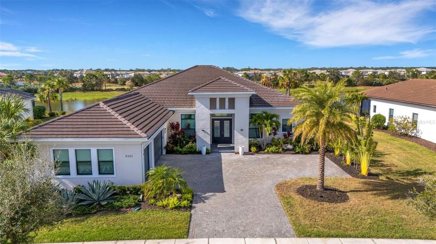 Experience a life of luxury, style, and comfort in this stunning, Kolter-built Palmer floorplan home that exceeds all expectations. Located in the desirable gated community of Artistry Sarasota, this breathtaking residence offers over 3,650 square feet of living space nestled on a picturesque waterfront home site. With three bedrooms, four and a half bathrooms, a den/office, and a dining room, this home is designed for both relaxation and entertainment.

One of the standout features is the upgraded "Club Room," which enhances the Palmer model. This impressive space can serve as a game room, provide guest privacy, or act as your personal retreat. The three-car garage offers ample room for vehicles and additional storage.

As you step through the grand entrance, you will be captivated by the meticulous attention to detail and impeccable craftsmanship that define this architectural masterpiece. Sunlight streams through the floor-to-ceiling hurricane-impact windows, creating a bright and airy atmosphere enhanced by sleek 24x24 porcelain tiles and designer finishes throughout. Each secondary bedroom features its own private en-suite bathroom and walk-in closet, offering added convenience and privacy.

The gourmet chef's kitchen is designed for seamless entertainment, equipped with upgraded GE Profile appliances and premium custom cabinetry, making it a culinary haven for any cooking enthusiast. Gather with loved ones in the expansive living areas, where soaring 12-foot ceilings and panoramic views of the surrounding landscape set the stage for unforgettable moments. Designs are available to add a private pool and spa.

Whether you’re hosting gatherings under the stars or exploring the vibrant Sarasota scene just minutes away, 8921 Artisan Way promises a lifestyle of unparalleled luxury and sophistication. Experience the pinnacle of coastal living in this nearly new residence nestled within the impressive enclave of Artistry. Beyond the gates of this exclusive community lies a world of refined elegance and breathtaking beauty, all awaiting your arrival.
THIS HOME IS AVAILABLE TO LEASE (UNFURNISHED) CONTACT AGENT JIM MANCUSO