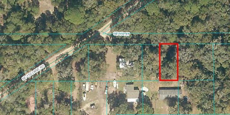 This .11-acre lot is located in Forest Lakes Campsites and features a dirt road and mature trees. Zoned R4 for site-built or mobile homes, this lot is flood zone x through most of the lot 3/4 of it the top right corner is flood zone A.