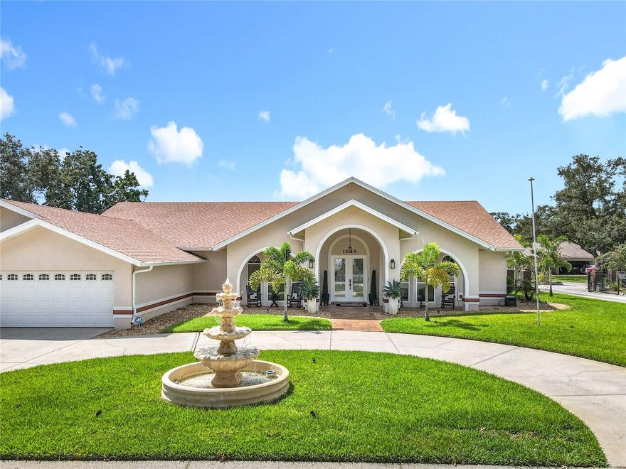 Stunning and one-of-a-kind 4-bedroom, 3-bathroom corner-lot home on 0.42 acres in Gated community, Remodeled and ready to impress! This home features a Gourmet Kitchen with Crown Molding, Luxury Cabinets, Quartz countertops, Double Ovens, and a top-of-the-line stove, a beautifully remodeled living room, and a primary bedroom with a new custom walk-in closet and luxurious bathroom with double sinks, bathtub, and shower. All bathrooms have quartz countertops, and crown molding runs throughout the entire home. Enjoy two cozy fireplaces, a second bedroom with walk-in closet and full bath, and a third bedroom with a walk-in closet. The garage has been upgraded with new lighting, two storage closets, brand-new garage doors, and new epoxy flooring. Step outside to a fully remodeled pool with saltwater system, new motor and pump, resurfacing, lighting, and a sound system, surrounded by new patio flooring, an extended concrete and paver area, a brand-new screened enclosure, a new fence with lights and doorbell, and a new carport for a boat with electricity and lighting. Additional upgrades include a freshly painted exterior, new gutters, soffit lighting all around the house, new water softener, security alarm system, exterior cameras, new sod, and sprinkler system in the front yard. Bring your boat, bring your jet skis; Situated on Lake Ariana with easy access to the surrounding chain of lakes, this home is perfect for boating, jet skis, and all your water toys, offering a true lifestyle experience Combining luxury, elegance, and functionality in a sought-after gated community, this home won’t last — Schedule Your Showing Today!