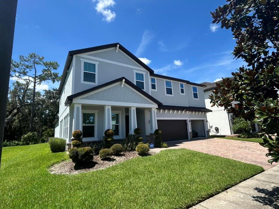 4100+ sq. ft., a sparkling pool, and a patio built for Florida sunsets—this is a homeowner’s dream. Perfectly placed on a corner lot in the heart of Southeast Orlando, minutes from Lake Nona, this 5-bedroom, 4.5-bath home delivers the rare combination of size, style, and location. HUGE SAVINGS with Solar panels. Every bedroom is complimented with its own walk in closet. Orlando’s world-famous attractions—Disney, Universal, SeaWorld—are just minutes away, the Atlantic beaches are less than an hour’s drive, and the airport is a straight shot for effortless travel. Surrounded by thriving development, boutique shopping, and dining, yet tucked within a community you’ll want to educate yourself about. Inside, an island kitchen commands the open layout, flex spaces, designer lighting throughout, iron staircase railings, designer walls, gourmet kitchen will adapt to your lifestyle, and every detail—from the flow to the curb appeal—feels intentional. Step outside to your private oasis, where the pool and expansive patio set the stage for everyday relaxation or unforgettable gatherings. Some addresses speak for themselves—this is one of them.