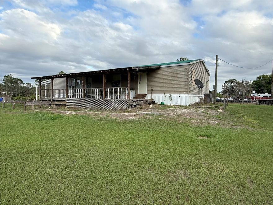 Great opportunity to own over 5 acres and a 3 bedroom 2 bath mobile home.  The home has a covered porch, carport, and sheds included.