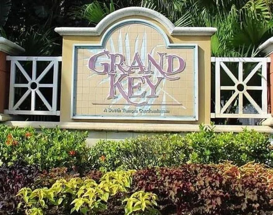 Welcome to your private retreat in the highly desirable Grand Key gated community. This immaculately maintained 2-bedroom, 2-bath condo is a top-floor corner unit, flooded with natural light and thoughtfully upgraded for comfort and style. The smart split-bedroom layout ensures privacy, while modern finishes make this home truly move-in ready. These are some of the highlights: • Elegant bamboo flooring throughout • New A/C (2023) for energy-efficient comfort • Bright, open living/dining space with ceiling fans • Screened-in balcony with an outdoor storage closet — perfect for morning coffee or evening unwind • Energy-efficient stainless steel appliances • Brand new dishwasher (2024) and large pantry • Full-sized washer and dryer • Owner’s suite features a luxurious walk-in marble shower linen closet & walk-in closet • Second bath updated with new tub, tile flooring, and modern finishes • Both bathrooms include chair-height toilets and contemporary tile upgrades.