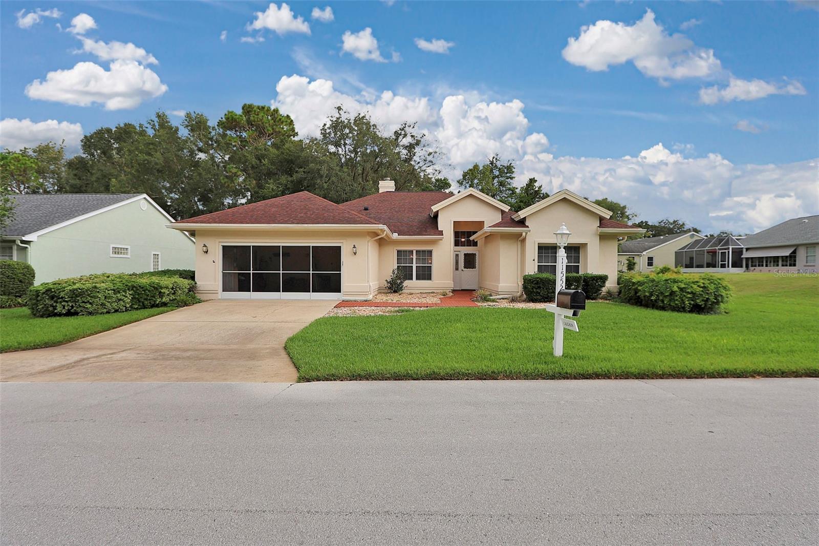 Welcome to this beautifully maintained 3 bedroom, 2.5 bath home with a 2-car garage, is perfectly situated in desirable 55+ gated community of Oak Run, Ocala FL. The open-concept living space is filled with natural light, creating a warm and inviting atmosphere and perfect for those that want to entertain. Home features two sided fireplace, large covered lanai for enjoying the private yard and Sport Pool that is 18' x 36'. Ideal for those backyard fun times with friends and family. The kitchen features all appliances, ample counter space, large working island, making it an entertainers dream kitchen. The spacious primary suite offers a private bath and generous closet space, while the additional bedrooms provide flexibility for guests, an office, or hobbies. Roof was replaced in 2016, HVAC 2020, and an additional den added in 2001 that creates the office work from home that we all need. Step outside to enjoy community amenities, including 6 pools, 5 hot tubes, 3 clubhouses, 2 fitness centers, 18 hole golf course, restaurant, bar and grill with patio, over 100 clubs to join to have an active lifestyle. Located near shopping, dining, and medical facilities, this home combines comfort, convenience, and vibrant community living.