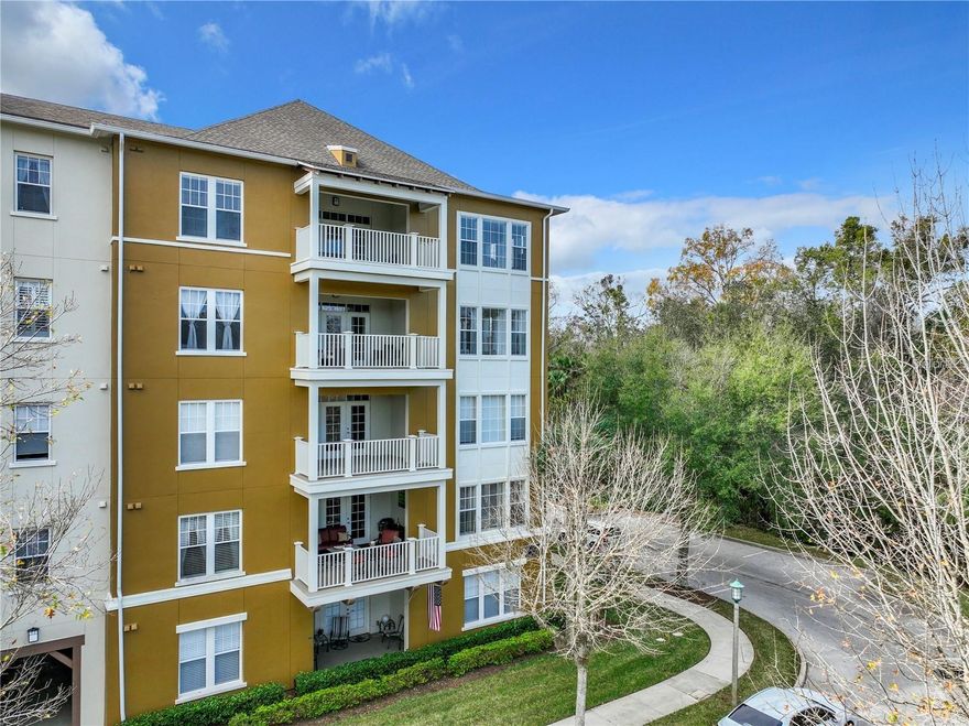 PRICED TO SELL!!  Gorgeous, 1st floor corner condo with stunning lake views.  Welcome to luxury living in Celebration's coveted Artisan Park with fabulous amenities.  This exceptional residence offers over 2000 sq ft of thoughtfully designed living space - all on one level - fabulous, sought after, private, corner location!!  Well maintained by current owner with recently installed AC, Water Heater and new carpets.  Light and spacious split floor plan featuring 3 bedrooms, 2.5 bathrooms with large primary suite with walk in closets, den/office space, gourmet kitchen and covered lanai overlooking pretty water views.  A private 1 car garage located next to the unit - fitted out with ample shelving.  Located in the heart of Artisan Park, residents enjoy exclusive access to private clubhouse.  Amenities including resort style pool, fitness center and cafe.  Beyond the building, Celebration offers over 26 miles of nature trails, multiple community parks, playgrounds, pool, and a vibrant town center filled with dining, shopping and year round events.  Conveniently located close to Disney World, Universal Studios and Orlando International Airport.  Do not miss this opportunity to live the Florida Lifestyle in this stunning home!