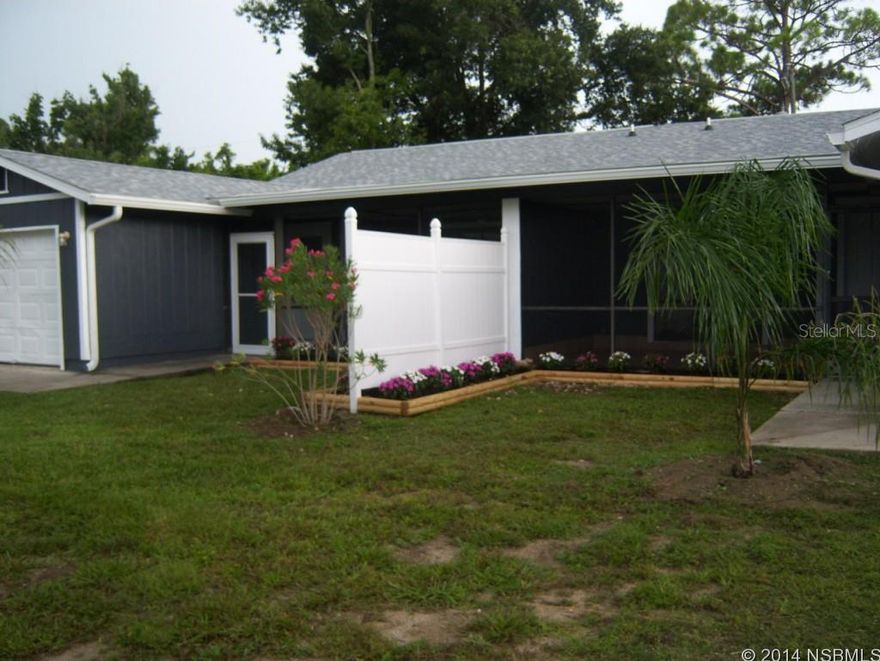 This is a MUST SEE! This duplex has been renovated!! Screened in front patio,Large Fenced in back yard. Beautifully landscaped.