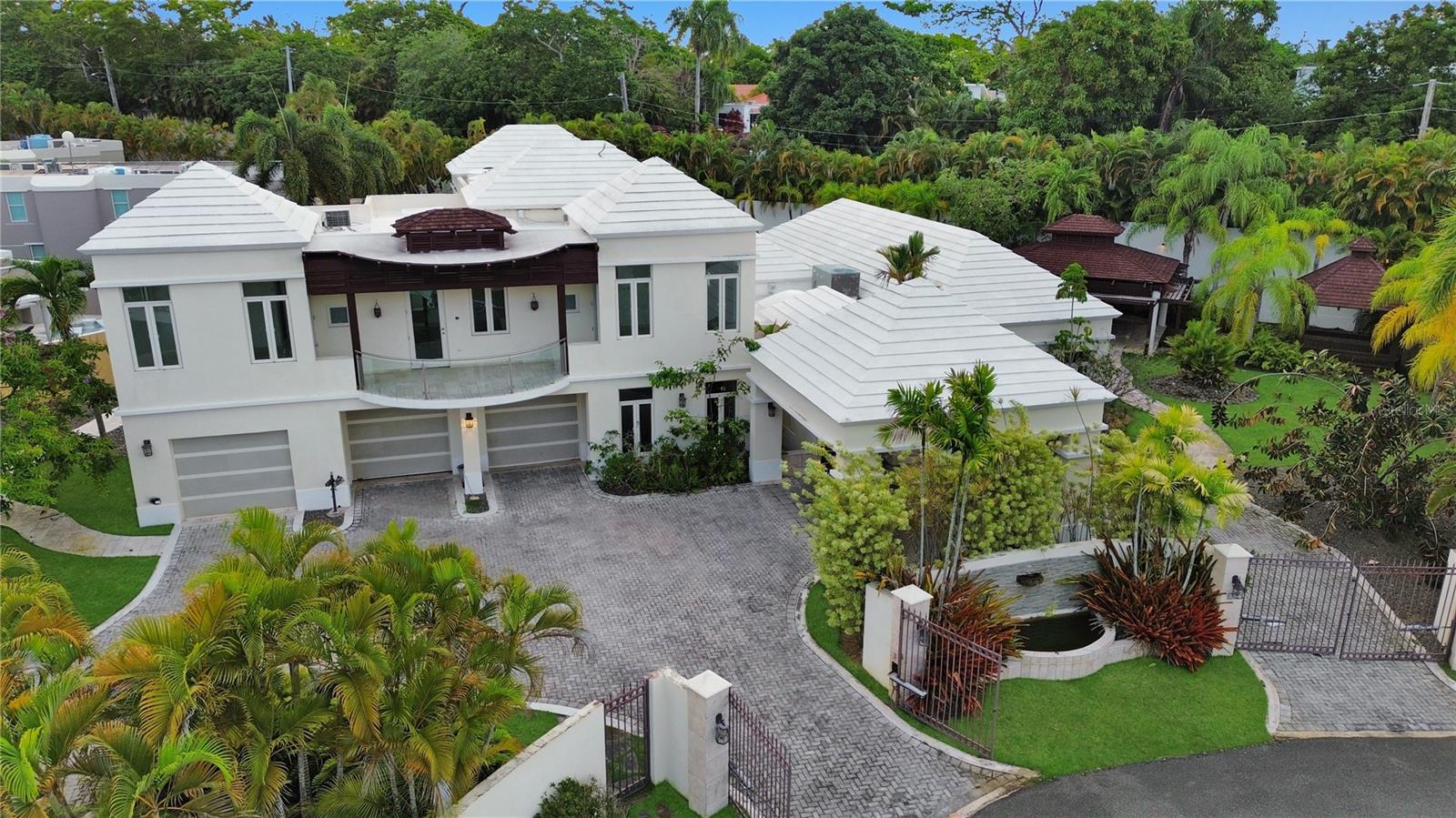 Welcome to the crown jewel of Paseos Las Palmas in Dorado, a remarkable residence situated on the largest lot (0.5 acres) in the entire neighborhood, spanning an impressive 5,344 square feet. This spacious home features 6 bedrooms, 6.5 bathrooms, offering a flexible and comfortable layout ideal for family living and entertaining. The outdoor area is a true private oasis, featuring a pool, gazebo, and expansive space designed for relaxation and connection. The oversized yard offers endless potential. Whether you envision a lush garden, an outdoor kitchen, a play area, or simply want to enjoy the open space, there is room to bring your vision to life. Located in a secure, family-friendly gated community just minutes from town, this home offers quick access to supermarkets, restaurants, pharmacies, and the beaches of Dorado. It is a unique opportunity to own a property that blends space, comfort, and outdoor living in a truly convenient location.
