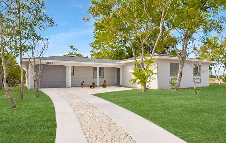 Welcome to this beautifully renovated 3 bedroom, 1.5 bathroom block home with a 1-car garage, offering just under 1,400 sq ft of modern living on an expansive cleared corner lot just under half an acre.
This smart-enabled home features a brand-new roof with hurricane clips and transferable warranty, plus a transferable termite warranty for added peace of mind.
Step inside to find all-new luxury vinyl plank flooring throughout, fresh interior and exterior paint, and a fully updated kitchen showcasing new shaker cabinets, quartz countertops, a stylish backsplash, pasta pot filler, and stainless steel appliances.
Major mechanical updates include a full PEX repipe, new water heater, and an A/C only 3 years old. Every bedroom and the living room feature new ceiling fans, and the home comes equipped with a Ring doorbell, smart lock, and smart thermostat.
The layout includes a versatile third bedroom off the garage, perfect as a studio, office, or den. The full bathroom boasts a stunning tile surround, new vanity, and toilet, with the half bath also fully updated.
The garage features a fresh epoxy floor and smart garage door opener. Outdoors, enjoy the large covered lanai with new ceiling fans, fresh paint, and complete re-screening. The massive backyard includes a fire pit and plenty of room for toys, a pool, or future additions.
No flood zone, no HOA, no CDD! A move-in ready smart home with modern upgrades inside and out. Contact our preferred lender to see if you qualify for up to $50,000 of interest free, forgivable, down payment assistance on this home!