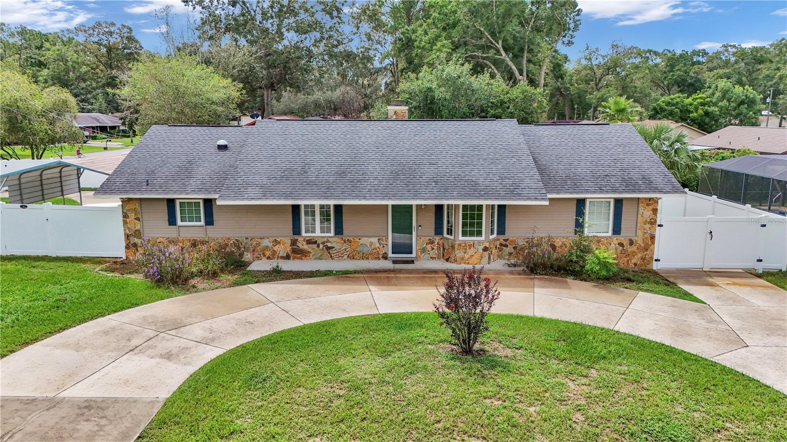 This property will WOW you, nothing to do but just move in. The lovely home has a lot to offer with 1800 living sq ft, 4 bedrooms and 2 full bathrooms, a triple split floor plan, with a large bonus family room on a corner lot. Home is nicely updated with upgraded features including stainless appliances. The primary has a large walk-in closet, and the ensuite has an oversized shower. You will love the added covered parking for 3 vehicles plus an additional space to park your boat or RV. There is a Generac generator 15kw, the roof is 8 yrs old and there are newer casement windows. The large shed has electric. Beautiful white vinyl fence that surrounds the property with side entrance for parking and an inviting circular driveway in the front. This home will impress you, lovely neighborhood and fantastic location close to downtown.