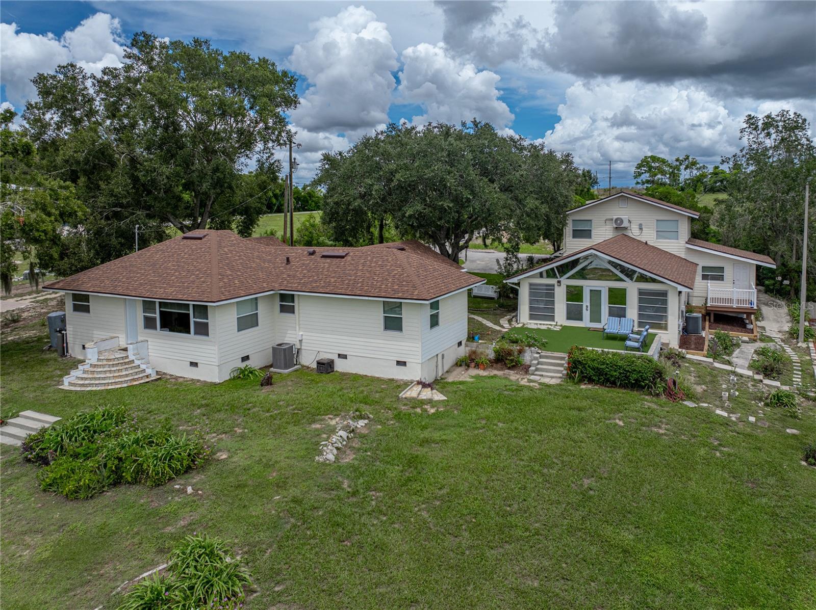 Lake Star Property with Multiple Dwellings & Endless Possibilities!
Discover a rare opportunity to own 3.39 acres of lakefront living on the shores of Lake Star. This unique property features a 3 bedroom, 2 bath home offering stunning lake views and even a view of Bok Tower! The spacious open living and dining area are great for entertaining. You’ll also enjoy a split bedroom layout, and charming pine hardwood floors. Recent upgrades include updated windows and doors, rewired electric, Hardie board siding, and additional insulation. New roof (2024) and new pump for well (2025)
In addition to the main home, the property includes a versatile guest dwelling with multiple rental options: a fully furnished studio apartment upstairs, a 2 bedroom/1 bath apartment downstairs, plus a shared recreation room complete with a sitting area, ping pong, pool table, sauna, full bath, and an open patio overlooking the lake and tennis court.
For your cars, boat, camper or toys there’s a 24’ x 40’ three-bay detached garage/workshop with plenty of storage.
This property is ideal for a family compound, multigenerational living, or as an income-producing investment property. Conveniently located near shopping, dining, and medical facilities, it combines privacy with accessibility. Close to Legoland and Winter Haven.
Don’t miss this one-of-a-kind lakefront opportunity!
