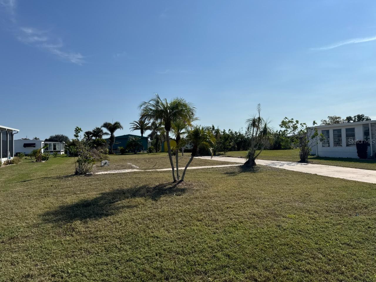 Welcome to Lemon Bay Isles — a beautiful and friendly manufactured home community in the heart of Englewood, Florida! This oversized vacant lot is the perfect blank canvas for your brand-new manufactured home and your ideal Florida lifestyle. There is NO LOT Lease, you OWN the land just like a regular home. Only 4.3 miles from the white sands of Englewood Beach on Manasota Key, you’ll have endless opportunities for sun, sand, and surf right at your fingertips.
This vibrant community offers wonderful amenities and welcoming neighbors, making it easy to feel right at home. Even better — utilities are already connected, saving you time and money when your new home is delivered. The listing agent can even connect you with trusted manufactured home dealers to make your dream home a reality.
Conveniently located near shopping, dining, golf, medical facilities, and some of the best beaches on Florida’s Gulf Coast — everything you need is close by. Don’t miss your chance to own a piece of Southwest Florida paradise and create the carefree coastal lifestyle you’ve always wanted!
There is a one-time Estoppel fee of $100 to be submitted with your HOA application.