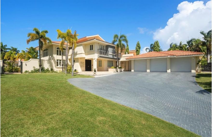 Luxurious Casona Carbia on a rare huge corner lot of 2,600 sq. m. and over 7,900 sq. ft. overlooking the Golf Course and lagoon. This exclusive hip-roofed contemporary house with 2 floors features: 5 bedrooms suites one with a private entrance, 8 full baths, 1 half bath, a studio with full bath, imposing marble floors all throughout the house with high ceiling, light-filled entertaining rooms, 2 covered terraces, 2 open terraces, private balconies in various rooms, a driveway that fits over 12 cars with a 3 car garage plus a golf cart garage. A full "Casita" guest house detached from the house with its own private entrance with wonderful entertaining, living facilities and wine cellar. The patio is a luxurious private oasis with an infinity pool and hot spa with shower, lush landscaping, several entertaining areas for lounging and entertaining. It has a unique location with direct access via golf cart to the beach.