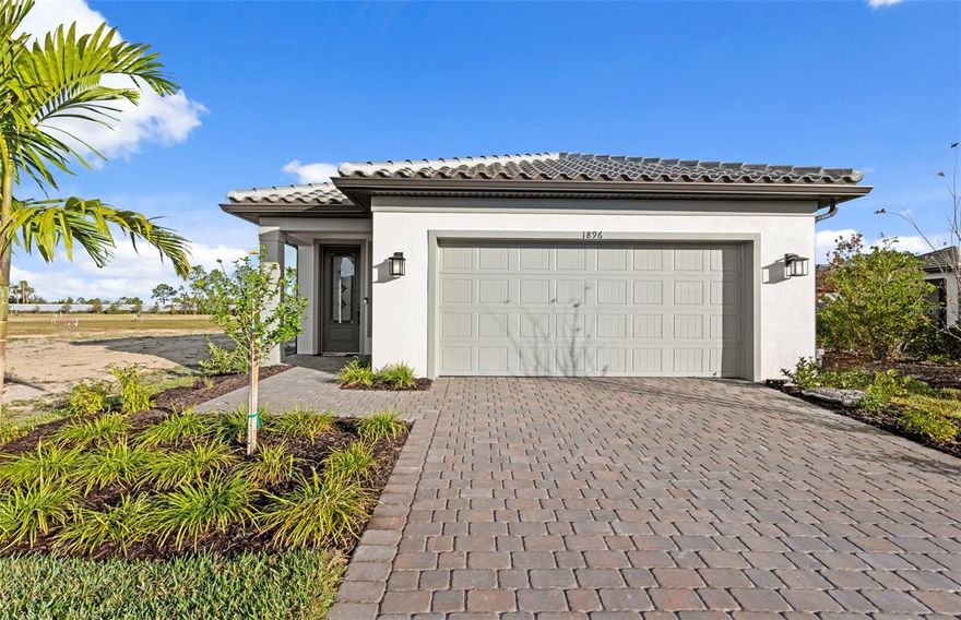 Under Construction. This Hallmark floorplan features 2 bedrooms, 2 bathrooms, a den, and a 2-car garage, offering a functional and stylish layout. Thoughtful upgrades include a pocket sliding glass door that enhances indoor-outdoor living, laundry room cabinetry, and white cabinets with matte black pulls paired with elegant quartz countertops. The home features 22"x22" tile flooring throughout the main living areas with carpet in the bedrooms, 8' interior doors, and upgraded 5" baseboards for a refined finish. A smart home package adds modern convenience, making this home both beautiful and functional. Beyond your doorstep, Arbor Oaks provides an array of resort-style amenities. Spend sunny afternoons at the pool with lap lanes and spa, unwind at the Barefoot Bar, or gather with friends by the Firepit Grill. The state-of-the-art clubhouse features a fitness center, community room, catering kitchen, activity rooms, and an outdoor veranda. Enjoy friendly competition on the pickleball, bocce ball, and tennis courts, or host a cookout at the BBQ grills. Your four-legged companion will love the community dog park, and for beach lovers, pristine destinations like Stump Pass State Park and Siesta Key are just a short drive away. Experience the best of Florida living at Arbor Oaks—your dream home awaits!
