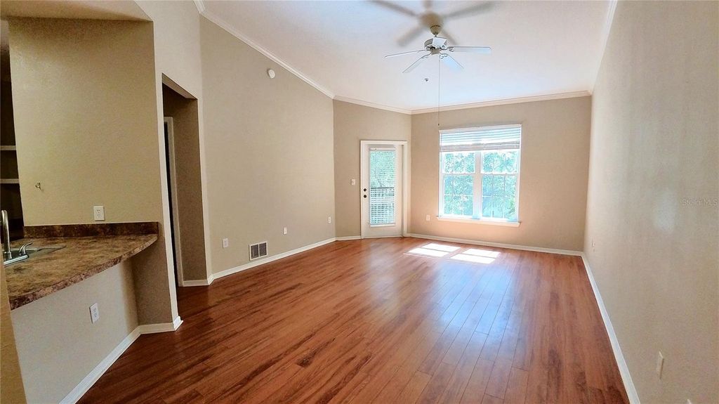 Photo of 10017 Courtney Palms Boulevard #304, Tampa, FL 33619 (MLS # O6404990)
