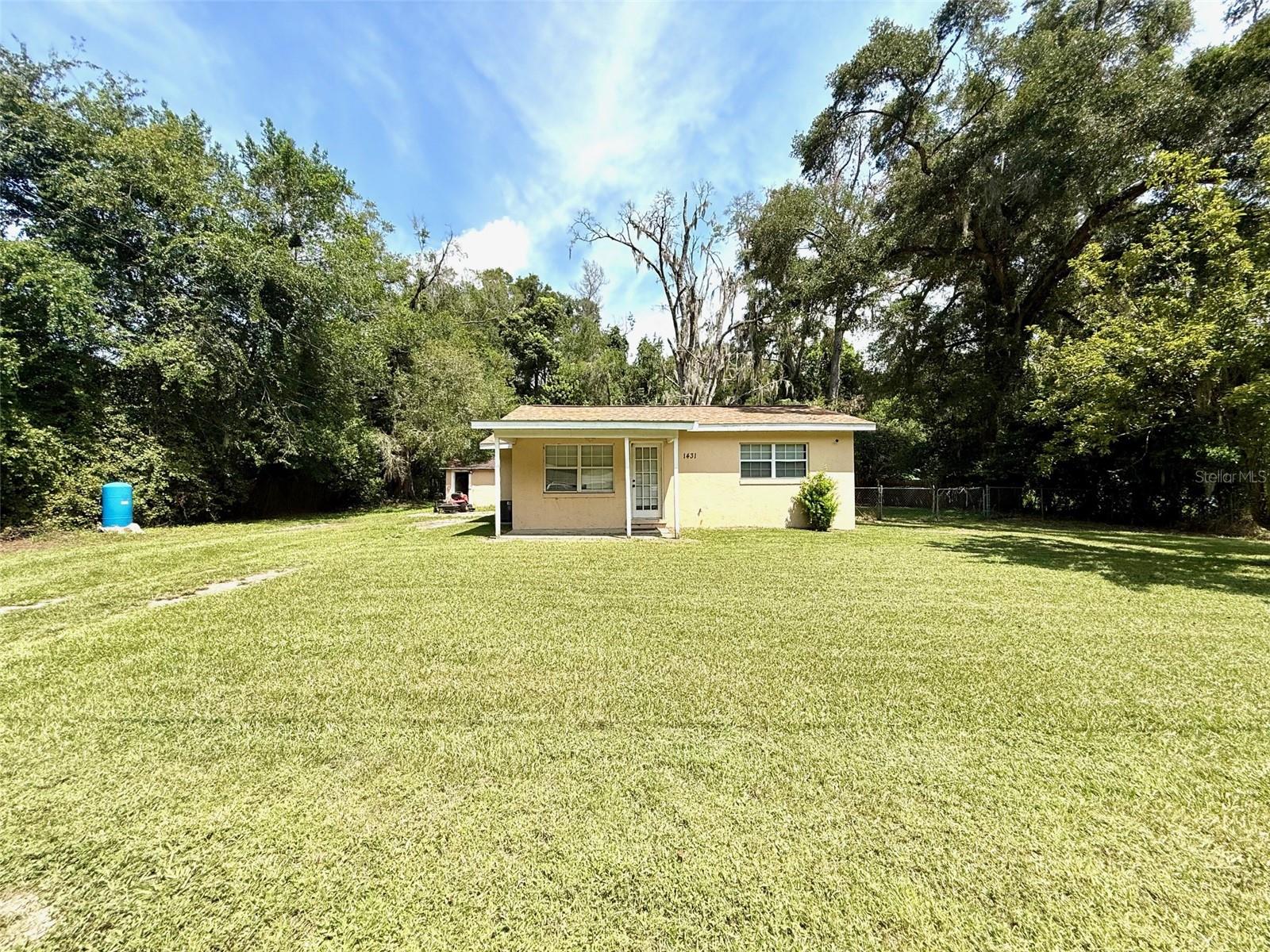 Tucked away at the end of a quiet dead-end road, this 2-bedroom, 1-bath home offers both privacy and potential. Sitting on an oversized lot, there’s plenty of room to enjoy the outdoors, with the bonus of an exterior storage area for tools, toys, or hobbies. Currently tenant-occupied with renters who would love to stay, this property makes an excellent investment opportunity. Alternatively, it’s a great fit for a starter home, downsizing option, or weekend retreat. Don’t miss the chance to own a versatile property in a peaceful Ocala setting!