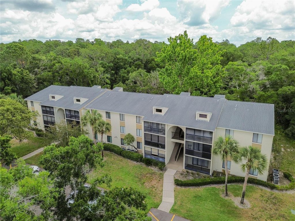 Photo of 3232 Lake Pine Way E #F3, Tarpon Springs, FL 34688 (MLS # TB8509382)