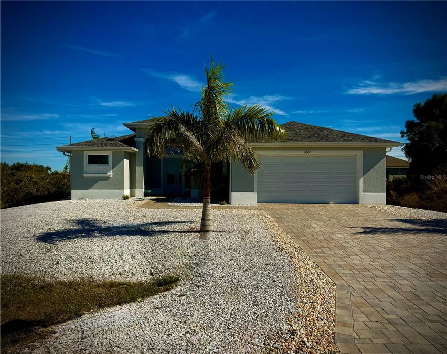 WHY BUY NEW?! This immaculate, meticulously maintained 1665 square foot three bedroom, two bath, two car garage quality constructed home built in 2021 is loaded with upgrades that you won't see in a majority of the "cookie cutter" new construction homes currently being offered in the area. The spacious living room includes upgraded crown and base molding with a tray ceiling, recently installed ship lap on the wall supporting the tv, triple corner sliding doors, ceramic plank flooring throughout the house, ceiling fan and a storage/coat closet located by the front door. The kitchen includes a high-end stainless-steel refrigerator, stove with convection oven, dishwasher, microwave and a custom stainless steel oven exhaust hood. There is a large island with a stainless-steel farm sink and pull-out brushed nickel faucet and garbage disposal. Custom granite countertops and a tile backsplash add to the beautiful decor of the kitchen along with the brand new ratan pendent lighting above the kitchen island. There is ample cabinet space along with two walk-in pantries. The bright and airy dining area includes recently installed raised paneling and chair molding, a new ratan pendent light fixture (matches the kitchen lights) with a sliding door leading out to the lanai/pool area. The primary bedroom is large enough to accommodate a king size bed with nightstands. There is a tray ceiling in the primary bedroom along with a ceiling fan, two oversized closets and a sliding door leading out to the lanai. The primary bathroom consists of two vanities with granite tops and undermount sinks with brushed nickel faucets, an expansive shower with custom color coordinating tile and a brushed nickel shower valve. The second bedroom encompasses a beachy feeling with recently installed custom shiplap, new paint, ceiling fan and a sliding glass door with custom vertical blinds and access to the lanai/pool area. The third bedroom was recently painted with recently installed custom window trim and blinds along with a ceiling fan. The guest bathroom includes a large vanity sink with granite top, brushed nickel faucet and custom lighting. There is a 5' tub with attractive color coordinating tile in the tub/shower area. There is a separate doorway which leads to the pool/lanai area. There is also a full-size laundry room with a washing machine/dryer, cabinets for storage and a laundry sink. The oversized lanai is an extension of the interior beauty of this lovely home with a custom-built wet bar with a butcher block top and cabinets, ice machine, stainless steel glass door refrigerator, a ship lapped wall with custom wood shelving, ceiling fan and an electric fireplace with multiple lighting/heating options. The attractive paving stones throughout the lanai were just recently resealed. The generously sized heated pool has an expansive sundeck with massage jets, custom LED lighting in the pool and an outdoor shower. The expansive lanai has ample space to comfortably accommodate several sitting areas for family gatherings and outdoor entertaining. The exterior of the home includes vinyl privacy fencing in the back yard with two gates, mature tropical palm trees and plants, custom outdoor lighting, irrigation system, low maintenance coquina crushed shell covering the front yard, sealed paving stone walkways and driveway, sitting area near the front entry and a Ring doorbell. This is your dream home in paradise!! And it won't last long. Schedule a showing today!!!