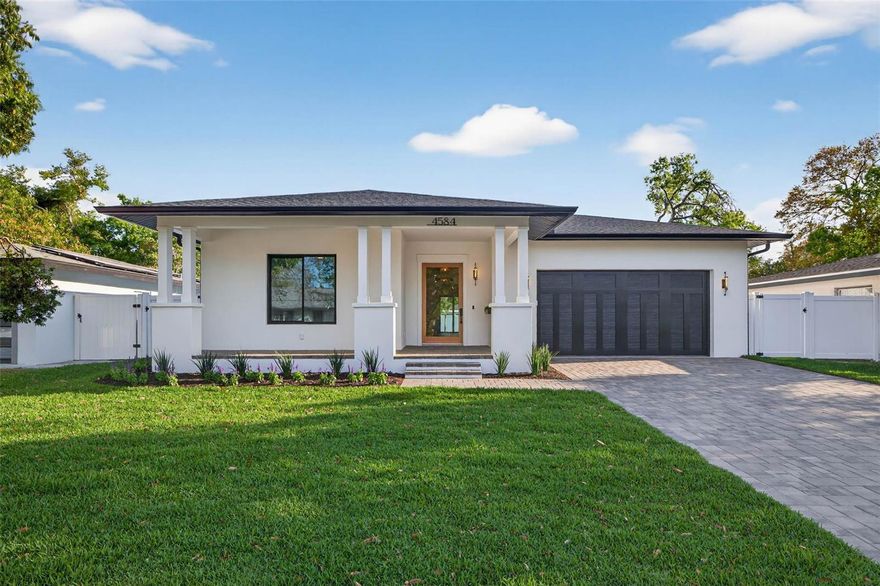 Welcome to this stunning new construction block home located at 4584 17th Ave N in the heart of St. Petersburg. Thoughtfully designed with modern finishes and functional living in mind, this beautifully crafted residence offers the perfect blend of style, comfort, and convenience.

Situated high and dry in a non-evacuation, non-flood zone, this home offers added security and long-term value. Located in a desirable Disston Heights neighborhood, you’re just minutes from vibrant downtown, waterfront parks, dining, shopping, and some of Florida’s most beautiful beaches.

From the moment you arrive, you’ll notice the clean architectural lines, fresh exterior design, and inviting curb appeal. Step inside to an open-concept floor plan filled with natural light, high ceilings, and premium finishes throughout. The spacious living and dining areas flow seamlessly into a chef-inspired kitchen featuring hardwood cabinetry, quartz countertops, stainless steel appliances, a large center island, and a walk-in pantry—perfect for both everyday living and entertaining.

The split-bedroom layout offers privacy and flexibility, with a luxurious primary suite that serves as a true retreat. The spa-like en-suite bathroom features dual vanities, a walk-in shower, a beautiful soaking tub, and elegant marble tile, creating a serene, spa-inspired space. The secondary bathroom also showcases beautiful marble finishes. Additional bedrooms are well-sized and ideal for family, guests, or a home office.

Designed for Florida living, the home offers seamless indoor-outdoor flow to a private backyard—perfect for relaxing, entertaining, or adding a future pool. With underground power already in place, the property is pool-ready for your custom outdoor oasis. Built with solid block construction, impact-rated windows and doors, and thoughtfully engineered for efficiency, this home features insulated interior walls, core-filled block, spray foam insulation in the attic for enhanced R-value, and a high-efficiency HVAC system—delivering year-round comfort and energy savings.

This move-in ready new construction home offers modern living in one of St. Pete’s most sought-after areas—schedule your private showing today.