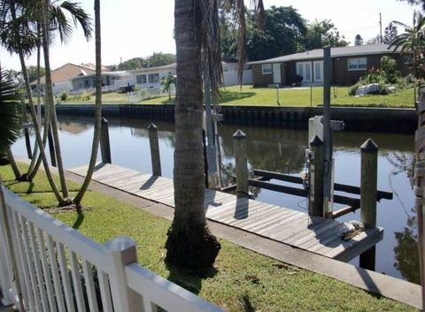 Photo of 9570 Sun Isle Drive NE, St Petersburg, FL 33702 (MLS # TB8457108)