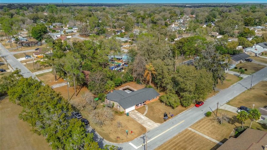 Situated on a desirable corner lot over a quarter acre, this property features a fully fenced yard offering privacy and space to enjoy. The home offers a formal living room up front along with a huge family room overlooking the patio and pool, making it ideal for both everyday living and entertaining. A roof replaced just 7 years ago adds peace of mind and long-term value, while the generous lot provides room for outdoor living, future expansion, or customization.