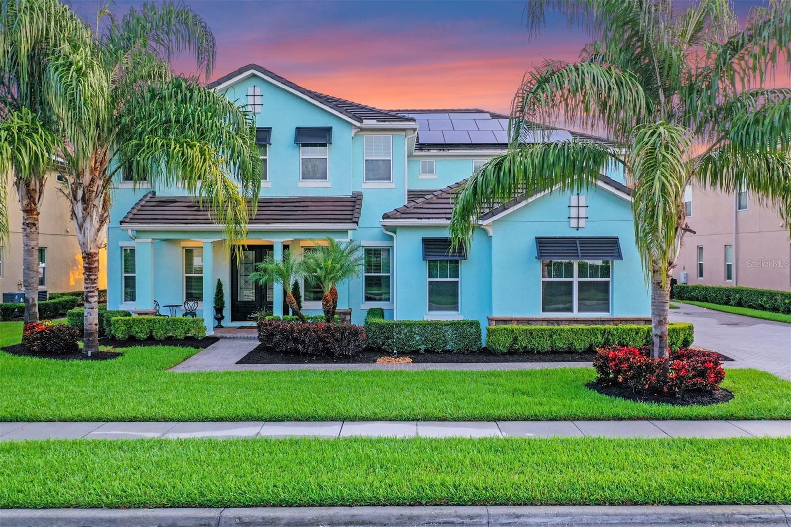 Under contract-accepting backup offers. Experience lakefront living at its finest with this stunning waterfront retreat, thoughtfully designed with luxury upgrades and modern convenience throughout. Built in 2018 and located in the Summerlake community of Horizon West, this Lauriston model offers nearly 5,320 square feet of living space set on 1.67 acres with sweeping views of Lake Hancock. From the moment you arrive, the home’s curb appeal shines with Bahama shutters, lush new landscaping, and a palm-lined entry that sets the tone for the elegance within. Inside, the thoughtful layout includes double primary suites—one on each level—along with multiple living areas—one on each level—, a dedicated office, an upstairs bonus room, two laundry rooms with premium appliances—one on each level—, and custom-updated closets throughout, making it ideal for both large households and multigenerational living. The gourmet chef’s kitchen is a true showpiece, complete with GE double ovens, a gas range, built-in refrigerator drawers, and a butler’s pantry, seamlessly flowing into the dining and living areas. Entertain at the custom bar with a w/100-year-old countertop, built-in beer tap, wine cooler, and refrigerator, set right off the main living area. Expansive stacking sliding doors lead to a resort-style backyard featuring a UV pool with a sun shelf, gas and electric heating, double fire pits, a lighting package, and retractable electric screens that create the ultimate indoor-outdoor lifestyle. An outdoor kitchen by Blaze adds a hibachi cooktop, grill, refrigerator drawers, and a large sink, all under a custom wood-trim ceiling that makes entertaining effortless. Beyond the pool, enjoy 80 feet of direct frontage and clear shoreline on Lake Hancock with your private dock, complete with water, electricity, lighting, a 10,000 lb boat lift, and dual jet ski lifts—perfect for sunset cruises, water sports, or simply taking in the lake life. Additional features include solar panels on the roof that continuously feed the grid with sufficient energy to cover the homeowners' monthly usage, a Rinnai tankless water heater, Nest thermostats with two-zone central air, a three-car garage with a charging station and storage racks, and a low $177 monthly HOA that offers access to a fitness center, pool, tennis courts, playgrounds, sidewalks, and golf cart-friendly streets. Zoned for highly rated schools, conveniently located minutes from shopping, dining, theme parks, and major highways, this property offers the perfect balance of tranquility and accessibility. This property combines thoughtful design, modern systems, and unmatched outdoor living—ready for its next owner to enjoy the ultimate waterfront lifestyle.