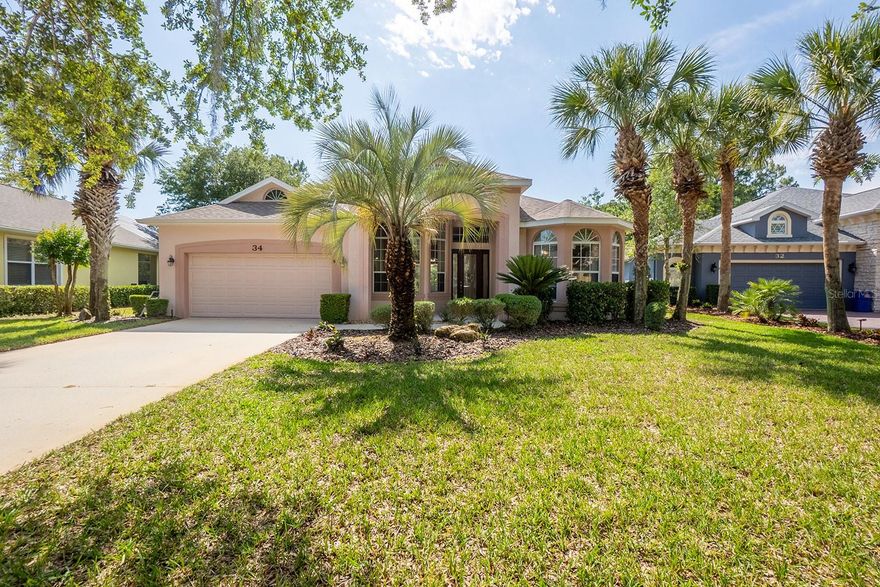 One or more photo(s) has been virtually staged. Experience the lifestyle that makes Grand Haven one of Palm Coast’s most sought-after gated communities. Nestled among mature landscaping and surrounded by the beauty of Florida’s Intracoastal lifestyle, this beautifully maintained one-owner 3-bedroom, 2-bath home offers the perfect blend of comfort, privacy, and resort-style living.

From the moment you arrive, you’ll appreciate features including a spacious 4-car driveway and an oversized front patio that creates the perfect setting for morning coffee, evening relaxation, or welcoming guests. Inside, soaring 13-foot ceilings enhance the open and airy feel of the home, while recent upgrades provide peace of mind and modern appeal. The roof was installed in 2023, and the bedroom, family room, and dining room flooring were updated in 2026. The kitchen features newer matching Whirlpool stainless steel appliances, while the oversized laundry room offers exceptional storage space and everyday functionality. The main living area is warm and inviting with a propane fireplace, creating the perfect atmosphere for cozy evenings at home. Having only one owner, the home has been lovingly maintained and cared for throughout the years.

Designed for both relaxation and entertaining, the backyard is a private retreat backing to a peaceful wooded area. Enjoy the tranquility of nature from your inground spa, creating the ideal outdoor setting to unwind after a day on the golf course or at the beach. The irrigation system is supplied by a well, helping maintain the landscaping efficiently while keeping utility costs lower.

Living in Grand Haven is about far more than just the home itself, it’s about embracing a true Florida lifestyle. Residents enjoy access to an impressive collection of amenities, including the Jack Nicklaus Signature golf course, multiple resort-style pools, tennis and pickleball courts, fitness centers, walking and biking trails, waterfront dining, playgrounds, and an active social calendar filled with clubs and community events. Scenic views of the Intracoastal Waterway and beautifully maintained surroundings make every drive through the community feel like a vacation.

Located in Palm Coast, residents also enjoy over 75 miles of trails, nearby beaches, boating, fishing, and easy access to St. Augustine and Daytona Beach. Whether you enjoy outdoor adventures, waterfront dining, or simply relaxing in the sunshine, Palm Coast offers the perfect balance of natural beauty and convenience.

If you’ve been searching for a home that combines privacy, thoughtful updates, exceptional amenities, and an unbeatable Florida lifestyle, this Grand Haven property is one you won’t want to miss.