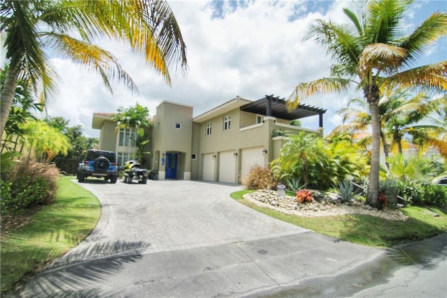 Your best choice in Dorado Beach East. This glamorous home is enveloped in luxurious design, details and finishes. A gorgeous 2 story Villa Carbia 2006 in the best location. Features 4 bedrooms on the second floor with 4 bathrooms, a “casita” (guest house) on the first floor with kitchenet and bathroom, large living, dining room, open kitchen to the family room, triple car garage, pool, covered terrace with wet bar, very private lot with lush landscaping, a tropical oasis ideal for relaxation and entertaining. Additional features are: all the Appliances included and top of the line, A/C split and central, generator, water tank, light fixtures and window treatments. Your best choice in Dorado Beach East.